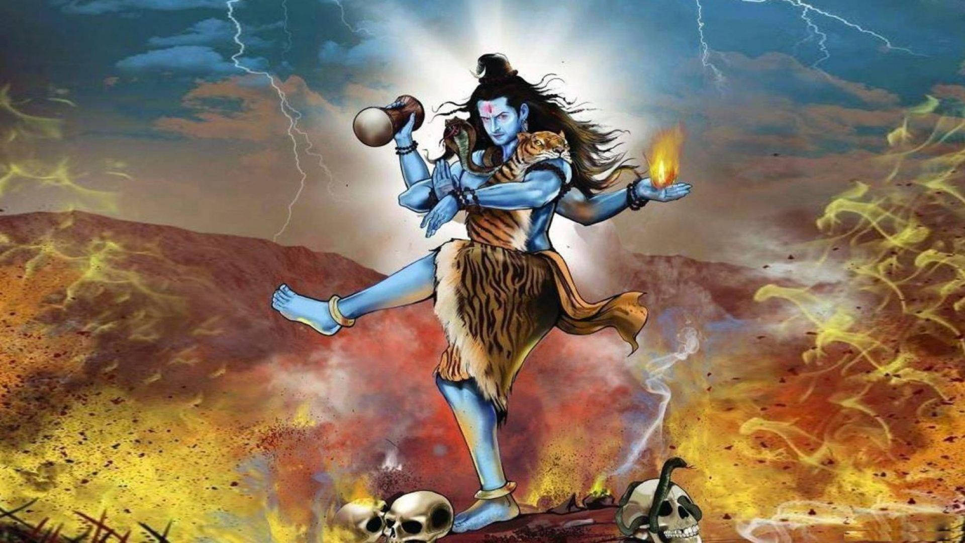 angry shiva 桌布 壁紙 — 一位藍皮膚的印度教神祇，身披虎皮和骷髏，在暴風雨的天空下，動態地站立在熊熊火焰和閃電之中。