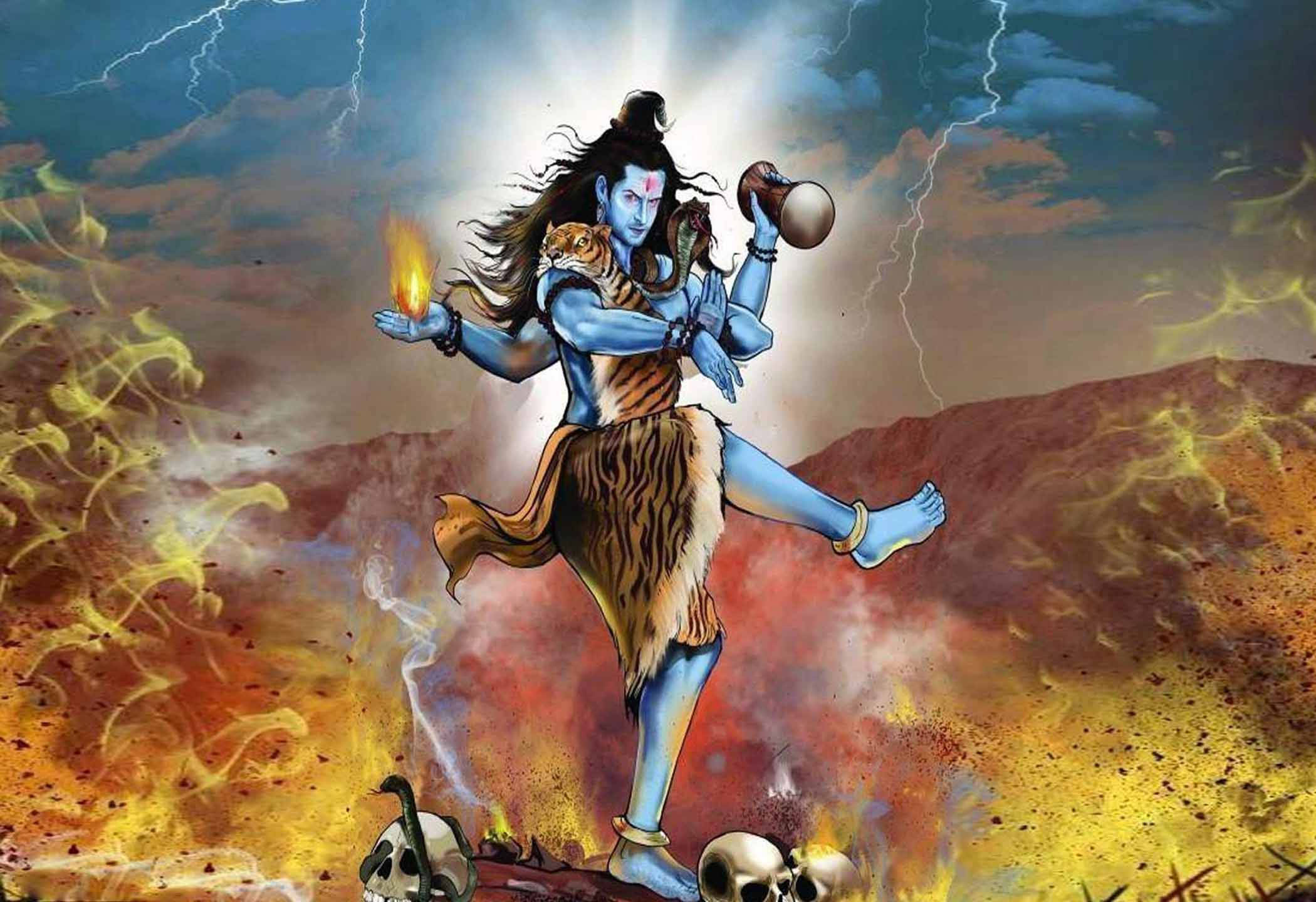 Hindu God 桌布 壁紙 — 一位藍皮膚的印度教神祇在火山景觀上方的熊熊火焰和閃電中動感起舞。