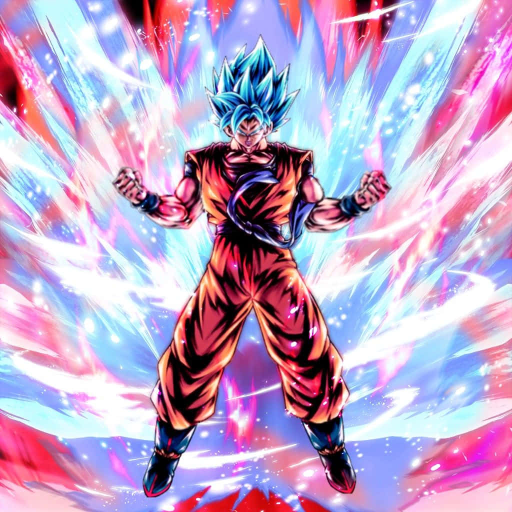Goku Kaioken 桌布 壁紙 — 一位藍髮動漫戰士穿著橙色道服，在動態戰鬥姿勢中散發出爆炸性的粉紅色和藍色能量。