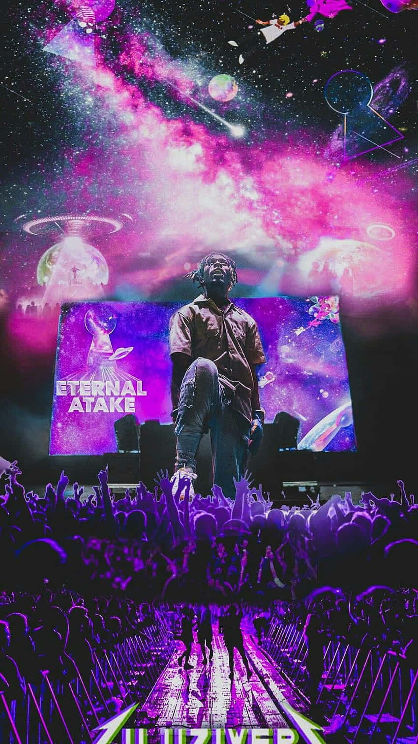 Lil Uzi Album 桌布 壁紙 — 一位表演者站在音樂會舞台上，下方是宇宙紫色銀河天空，有UFO和歡呼的人群。
