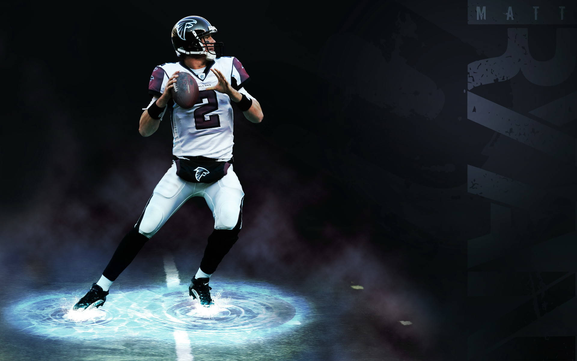 NFL 美式足球 桌布 壁紙 — 一位身穿亞特蘭大獵鷹隊裝備的美式足球四分衛，在戲劇性的聚光燈下，腳下閃爍著藍色能量，準備投球。