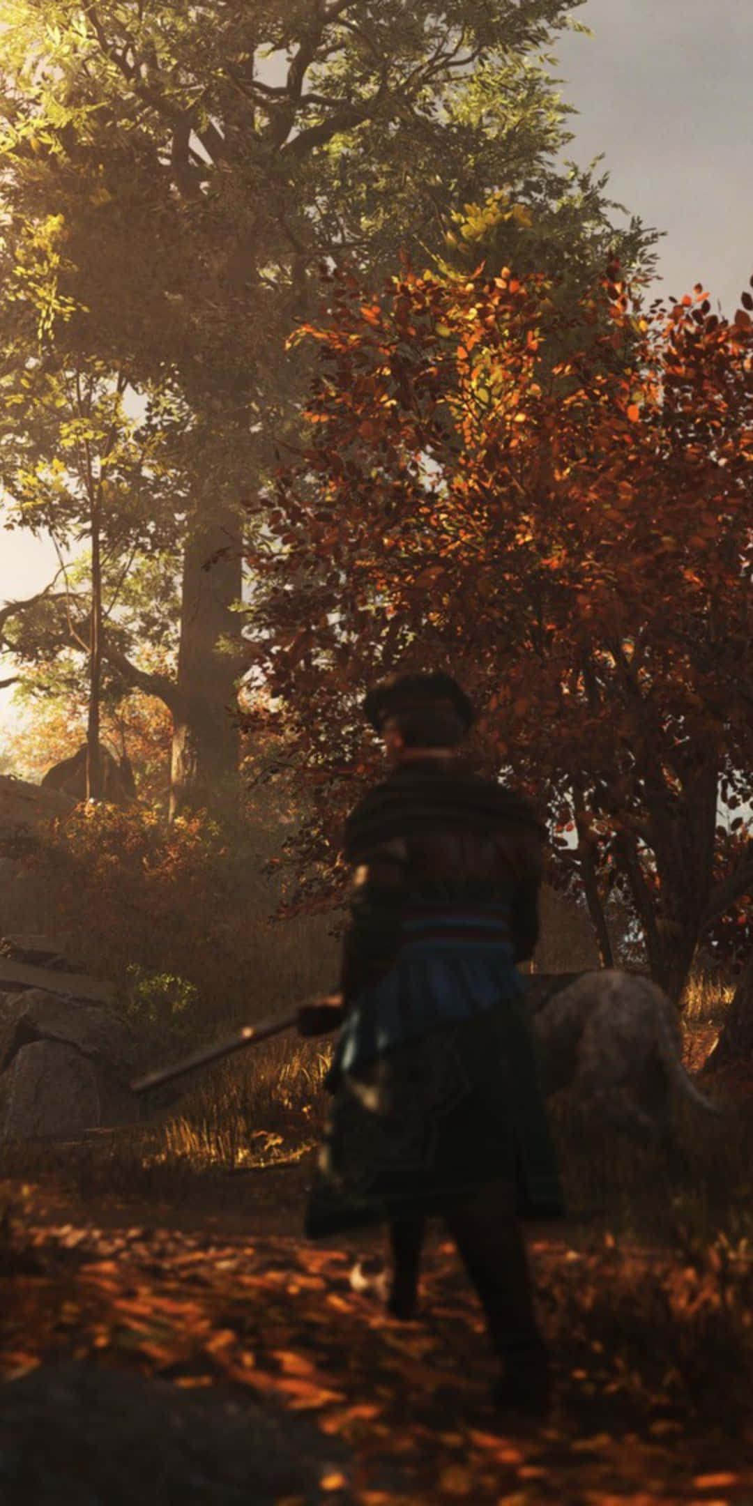 Pixel 3 Greedfall 桌布 壁紙 — 一位身穿傳統服飾的戰士走過陽光明媚的秋日森林，金色樹葉在腳邊旋轉。
