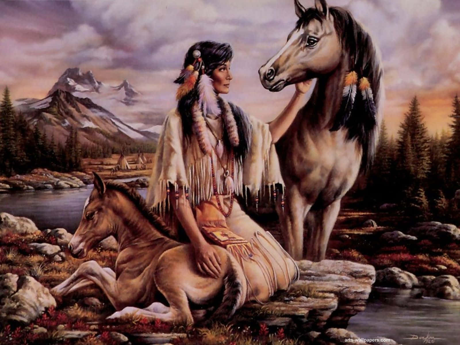 American Indian 桌布 壁紙 — 一位身穿傳統服飾的美國原住民女性在河邊輕撫一匹馬和一匹小馬，背景是白雪覆蓋的山脈。