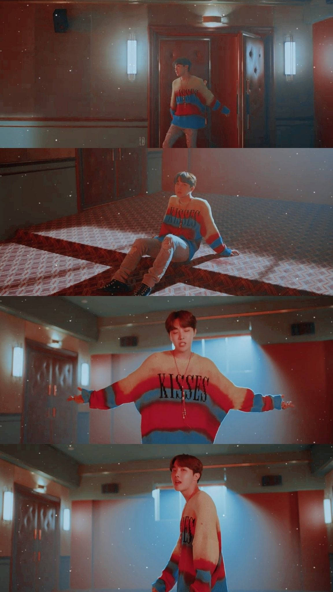 j-hope 桌布 壁紙 — 一位身穿彩色條紋毛衣的年輕男子在溫暖照明的走廊中擺姿勢，走廊有紅牆和圖案地毯，並有星光效果。
