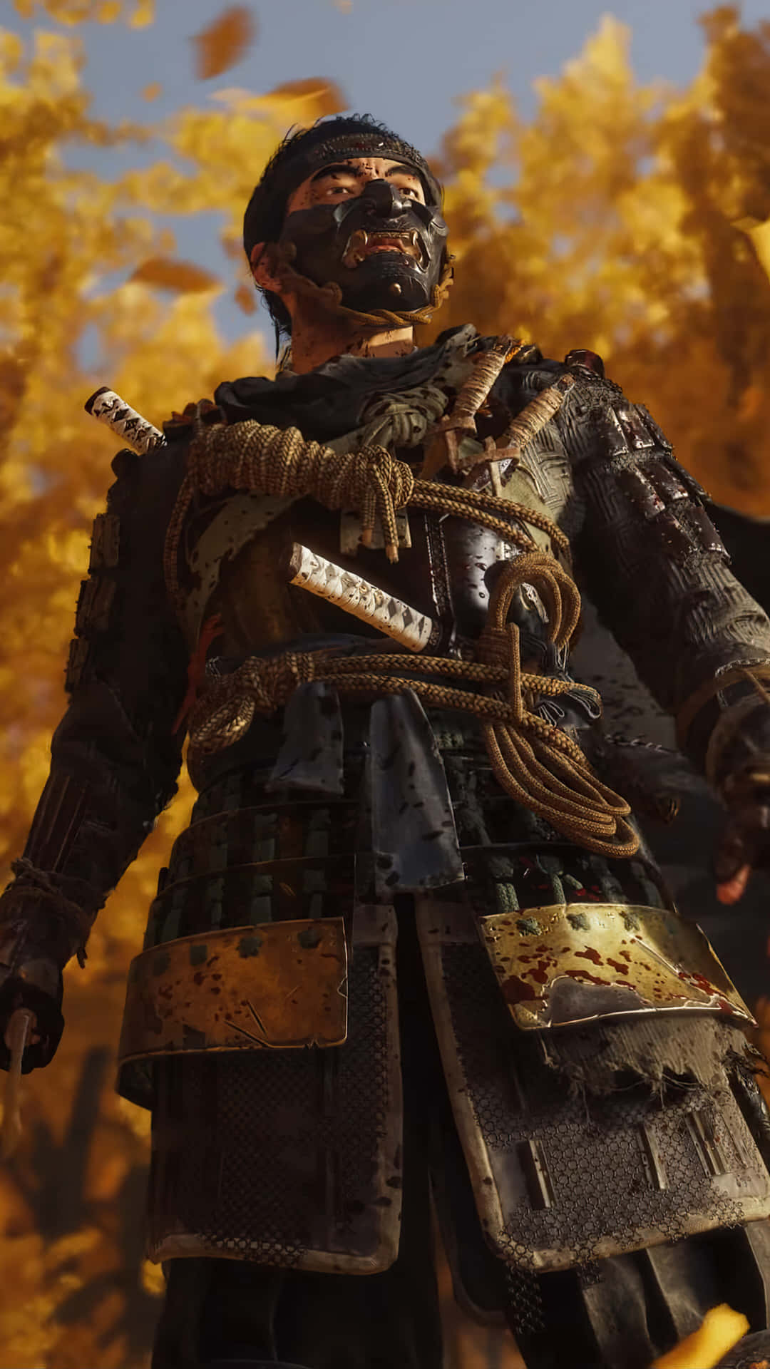 電玩遊戲 桌布 壁紙 — 一位身穿戰損鎧甲的武士戰士，在金色秋葉飄落的背景下，挑釁地站立著。