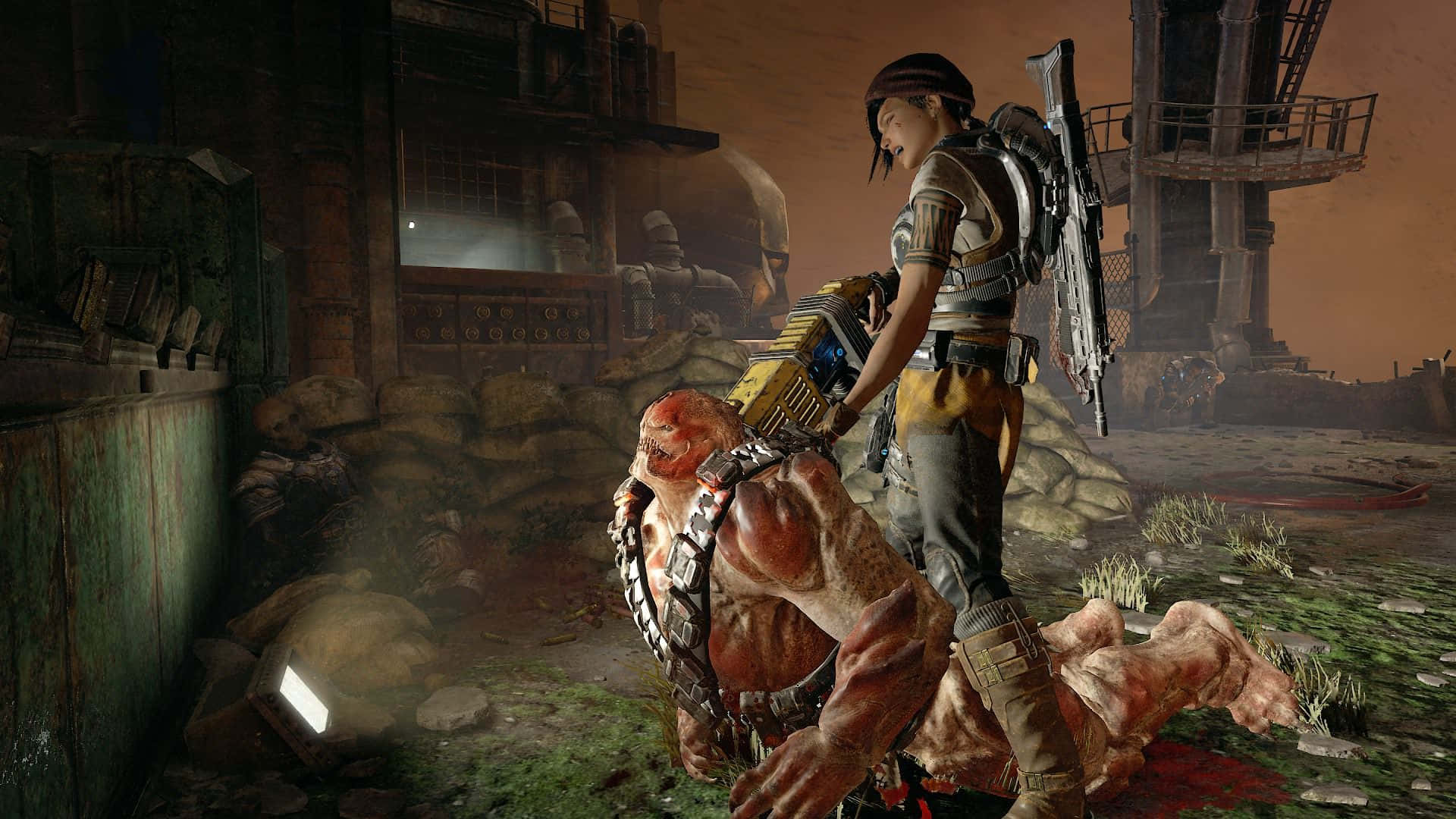 1920x1080 Gears Of War 5 桌布 壁紙 — 一位身穿戰術裝備的女戰士站在被擊敗的怪物敵人之上，背景是廢棄的工業荒地。