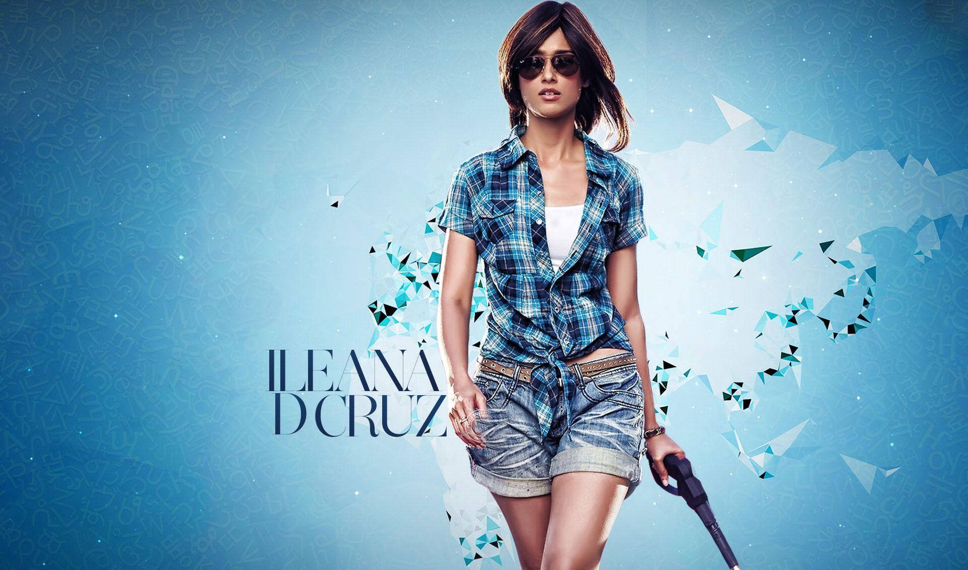 Ileana D'cruz 桌布 壁紙 — 一位身穿格紋襯衫和牛仔短褲的女性自信地站立，手持槍枝，背景為藍色幾何圖案。