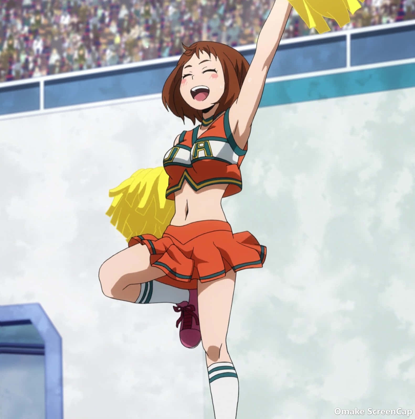 Cheer 桌布 壁紙 — 一位身穿橙色制服、充滿喜悅的動漫啦啦隊員在擠滿觀眾的體育館中拿著彩球跳躍在半空中。