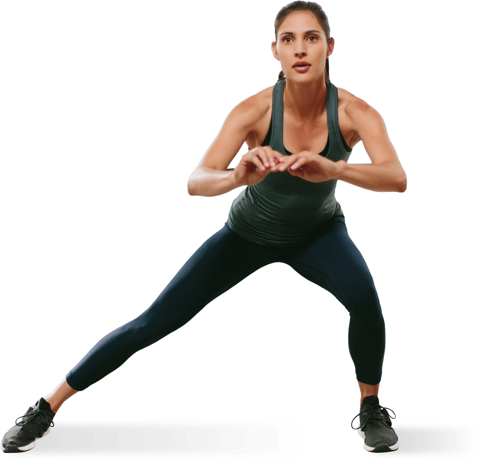 aerobics 桌布 壁紙 — 一位身穿深色運動服的健美女性，在純綠色背景前做出動態的弓步姿勢。