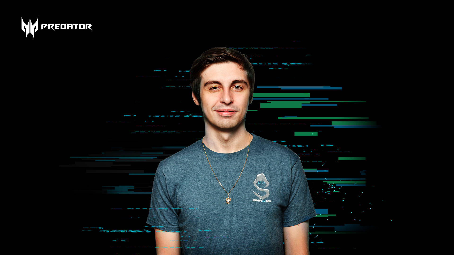 Shroud 桌布 壁紙 — 一位身穿灰色T恤的年輕男子在帶有藍色和綠色數據條紋的故障數位背景前微笑。