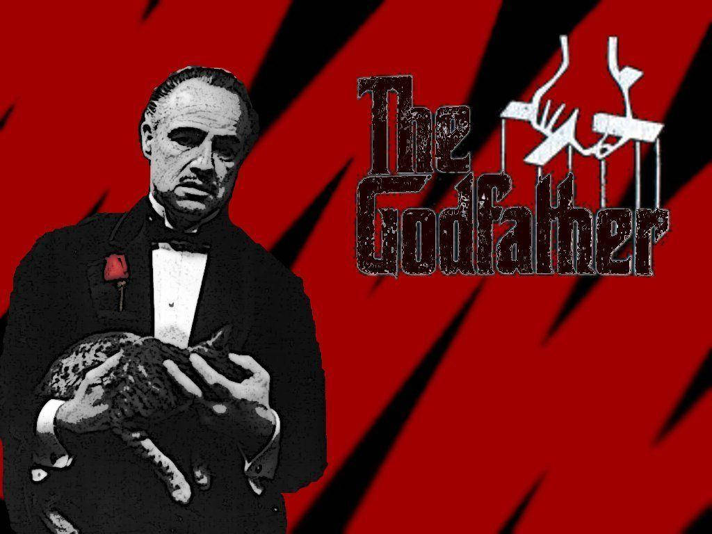 Godfather 桌布 壁紙 — 一位身穿燕尾服的男士在搶眼的紅黑背景前抱著一隻貓，背景上有『教父』標誌。