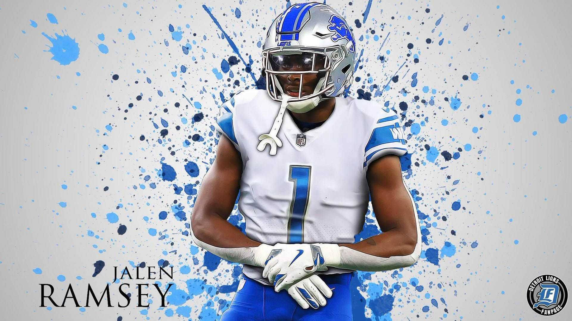 Ramsey 桌布 壁紙 — 一位身穿白色和藍色球衣的底特律雄獅美式足球員，自信地站在動態的藍色油漆飛濺背景前。