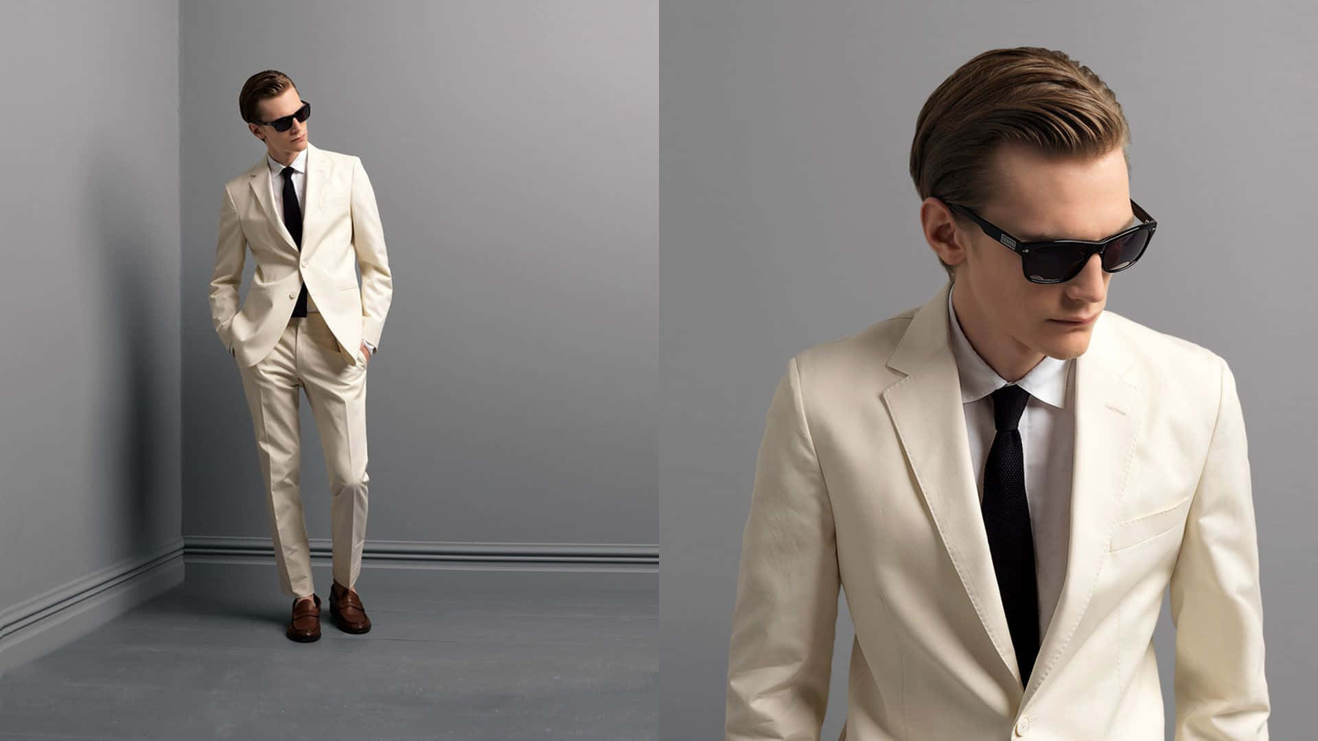 Mens Fashion 桌布 壁紙 — 一位身穿米色西裝和黑色領帶的時尚男士，在簡約的灰色攝影棚中自信地戴著太陽眼鏡擺姿勢。