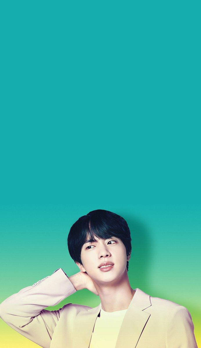 Jin 桌布 壁紙 — 一位身穿米色西裝外套的年輕男子在充滿活力的青綠色到黃色漸變背景前擺姿勢。