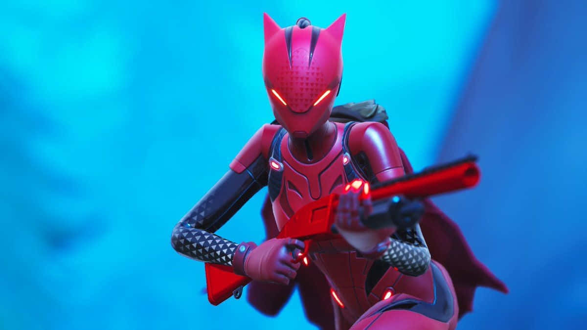 Fortnite 桌布 壁紙 — 一位身穿紅色盔甲、貓耳、眼睛發光的超級女英雄，正用未來武器瞄準充滿活力的藍色背景。