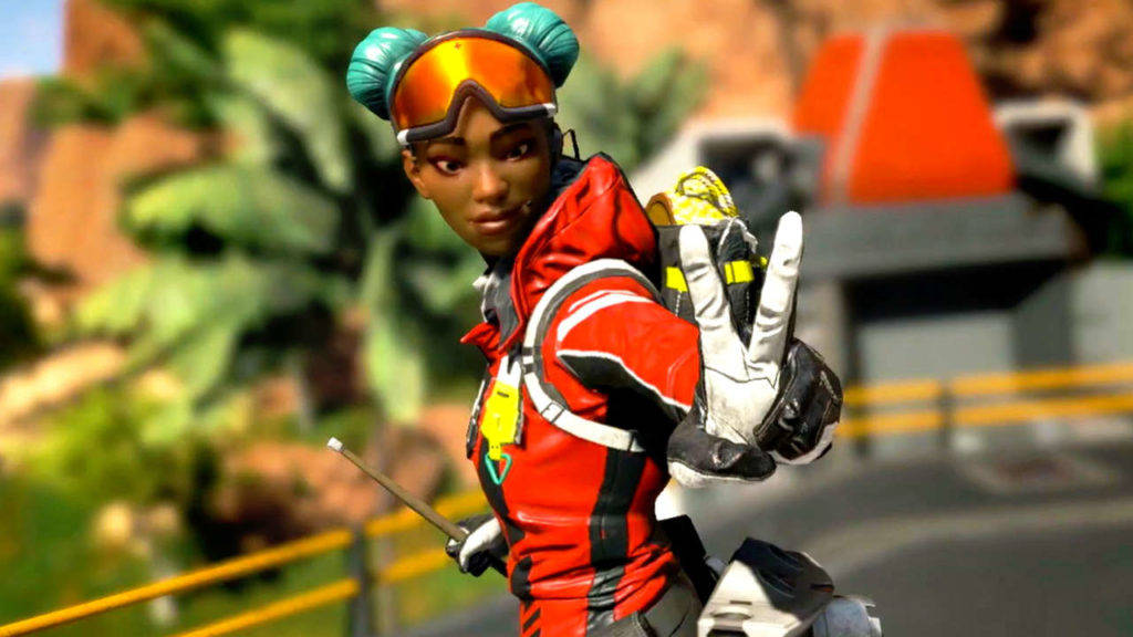 Cool Apex Legends 桌布 壁紙 — 一位身穿紅色裝備、梳著青綠色髮髻、戴著橙色護目鏡的女性電子遊戲角色向鏡頭揮手。