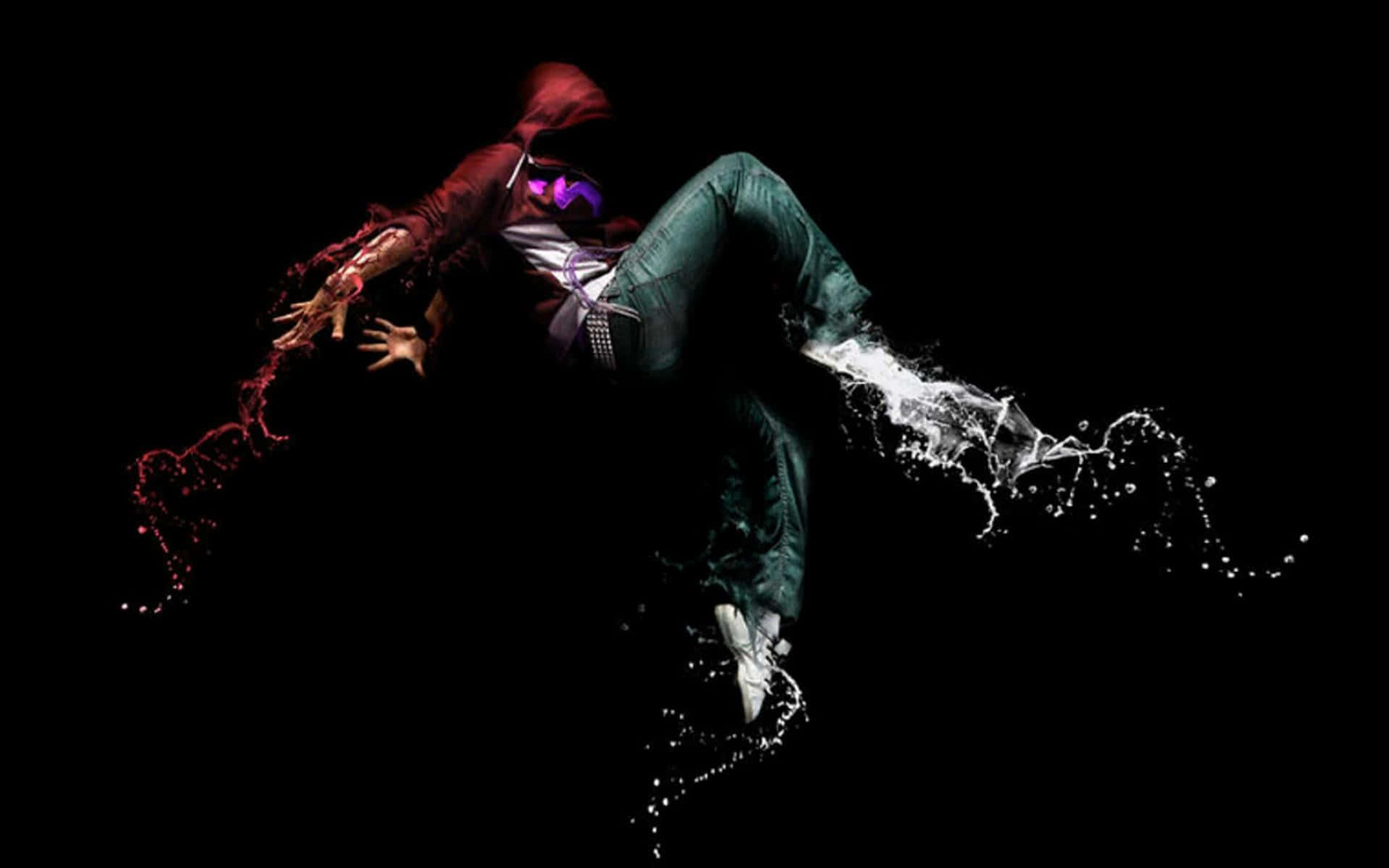 breakdancing 桌布 壁紙 — 一位身穿紅色連帽衫和綠色褲子的霹靂舞者在空中，肢體濺出液體效果，背景為黑色。