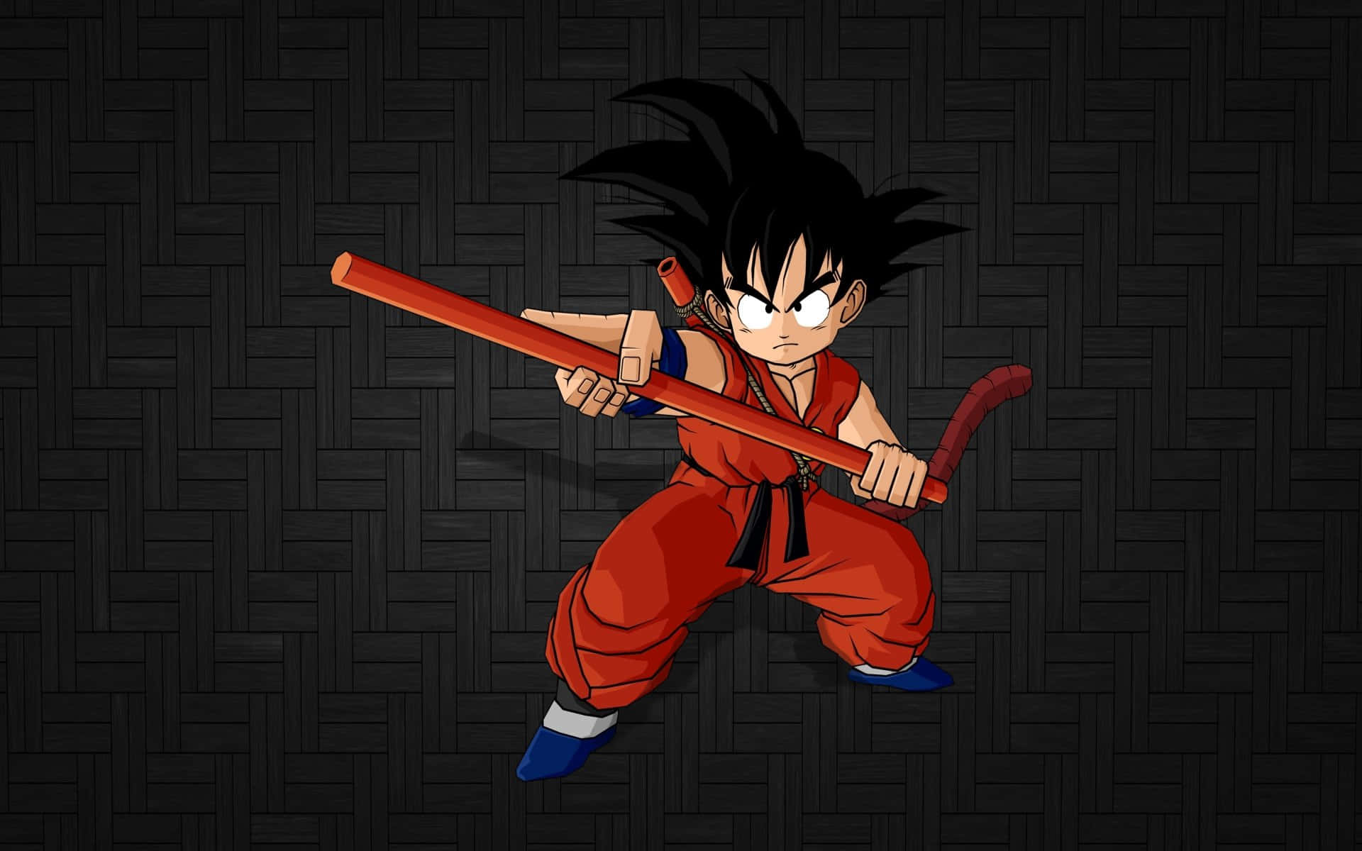 Dragon Ball Z Characters 桌布 壁紙 — 一位身穿紅色道服的年輕動漫戰士，在深色編織背景前以動態戰鬥姿勢揮舞紅色長棍。