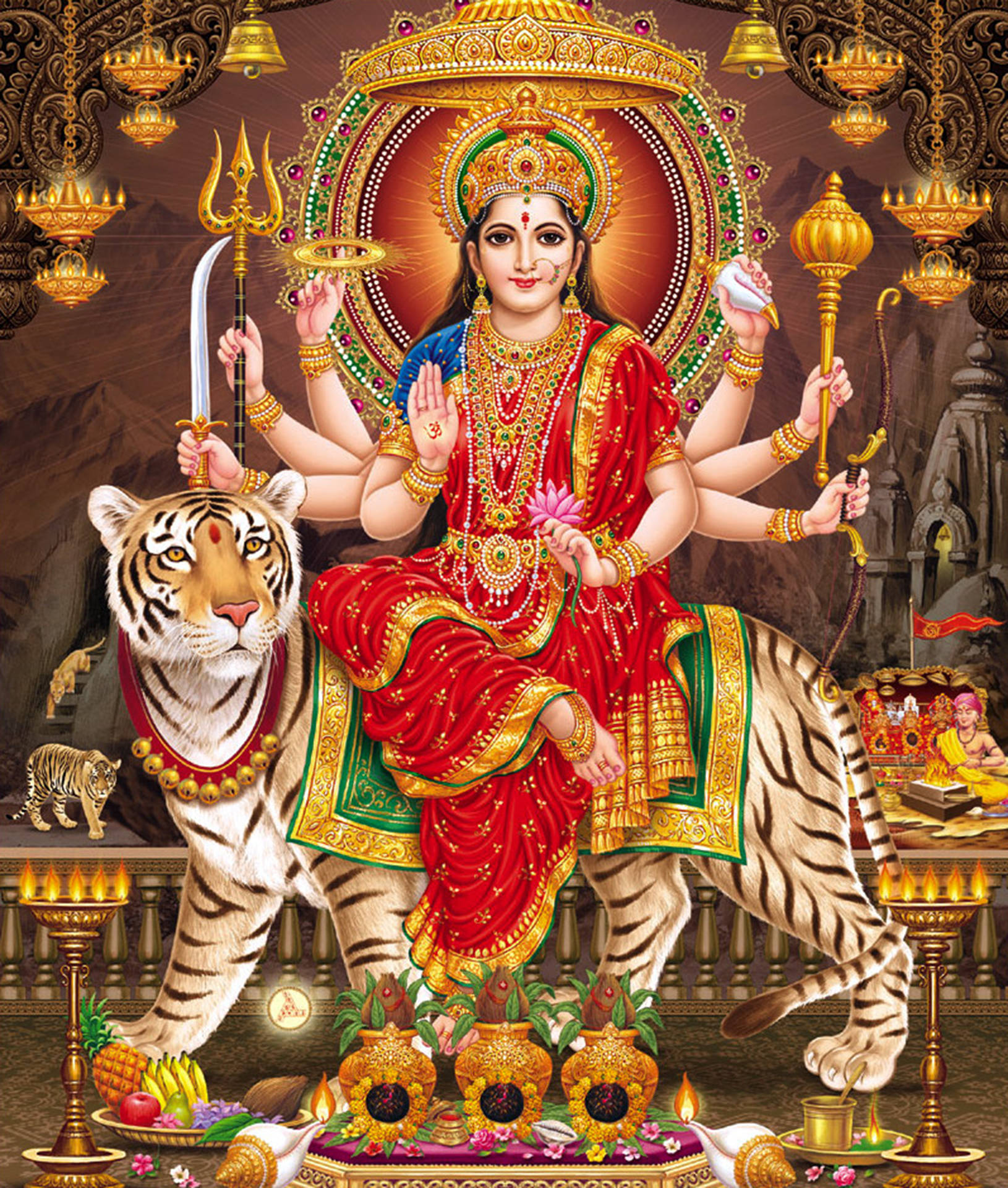 Durga 桌布 壁紙 — 一位身穿紅金服飾、光芒四射的多臂印度教女神，威嚴地坐在虎王座上，周圍是華麗的金色燈籠和供品。