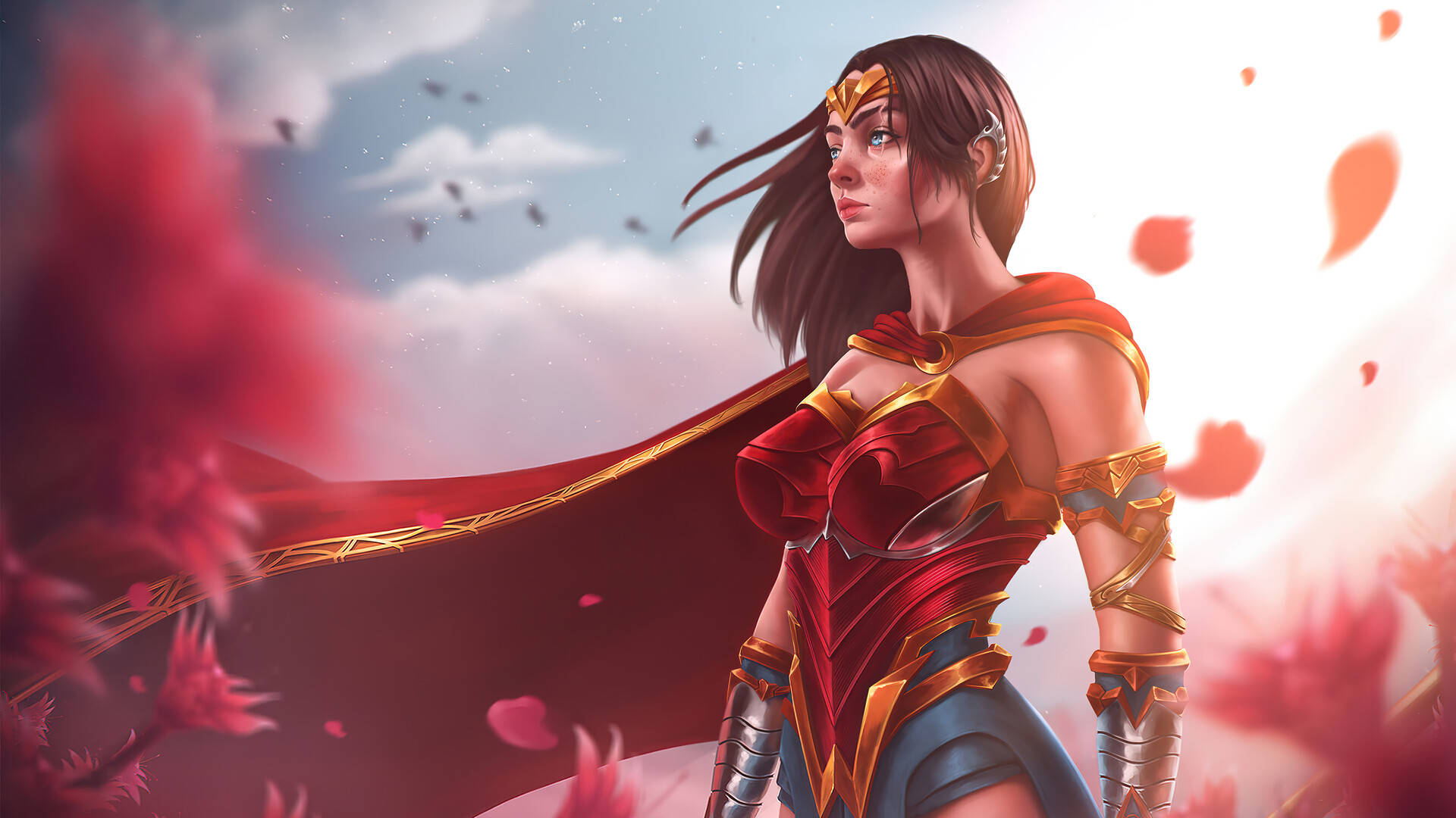 Wonder Woman 桌布 壁紙 — 一位身穿紅金鎧甲的女英雄站在陰雲密佈的天空下，周圍飄落著粉紅色的花瓣。