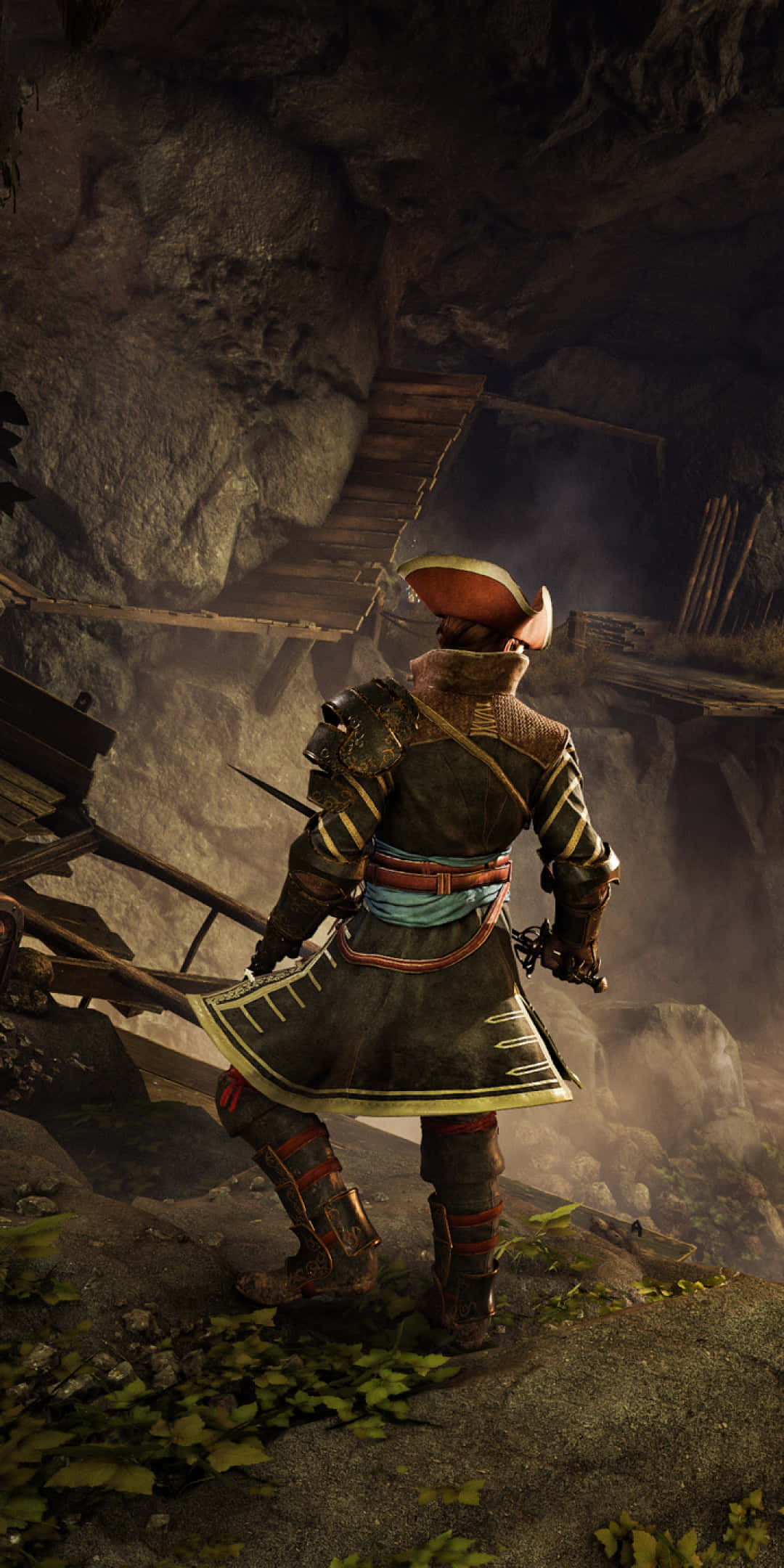 Pixel 3 Greedfall 桌布 壁紙 — 一位身穿華麗盔甲的武士站在霧氣瀰漫的洞穴入口邊緣，下方有木製鷹架和發光的綠色苔蘚。