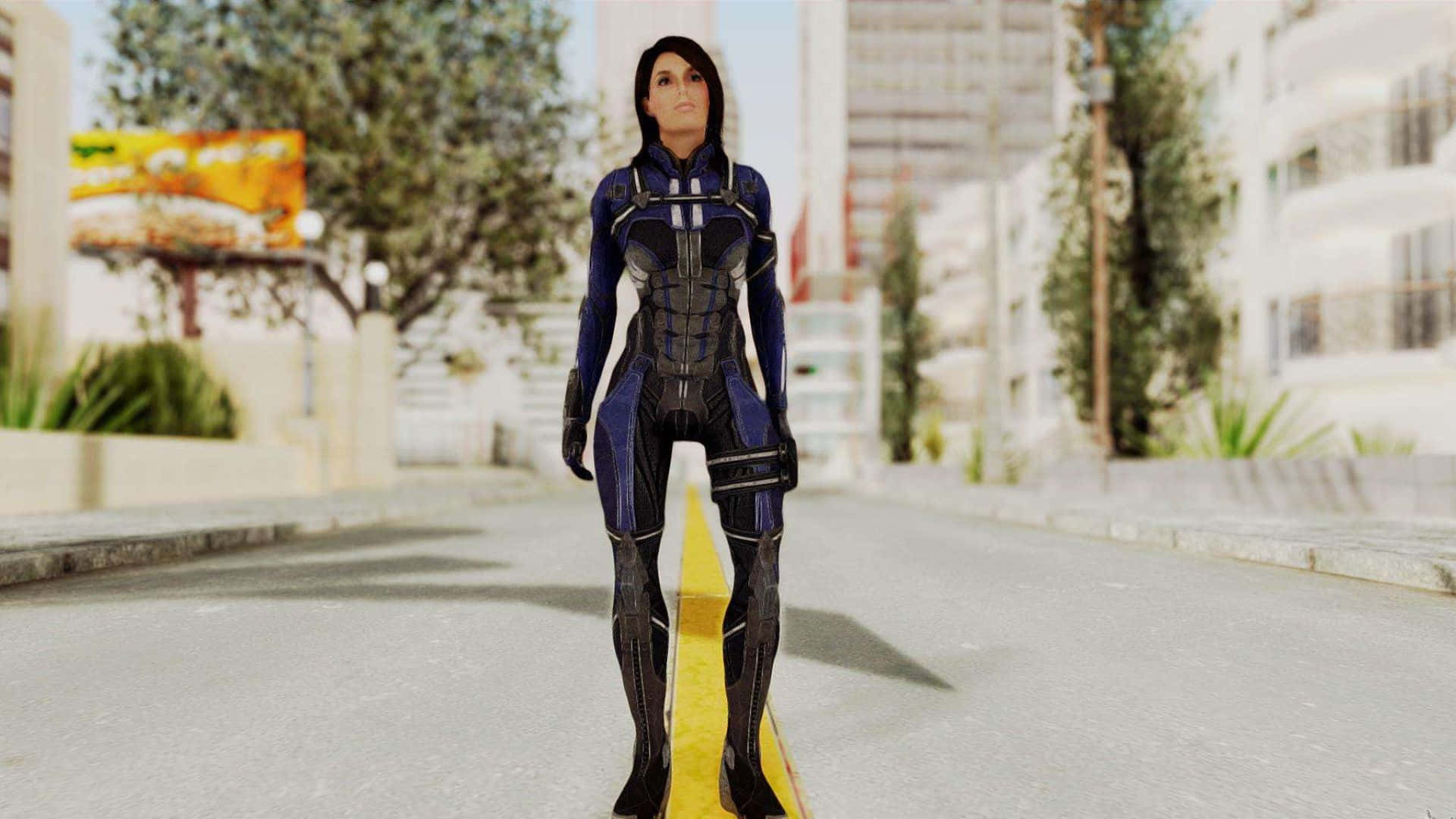 Ashley Williams 桌布 壁紙 — 一位身穿藍黑裝甲服的女超級英雄自信地站在一條有黃色條紋的城市街道上。