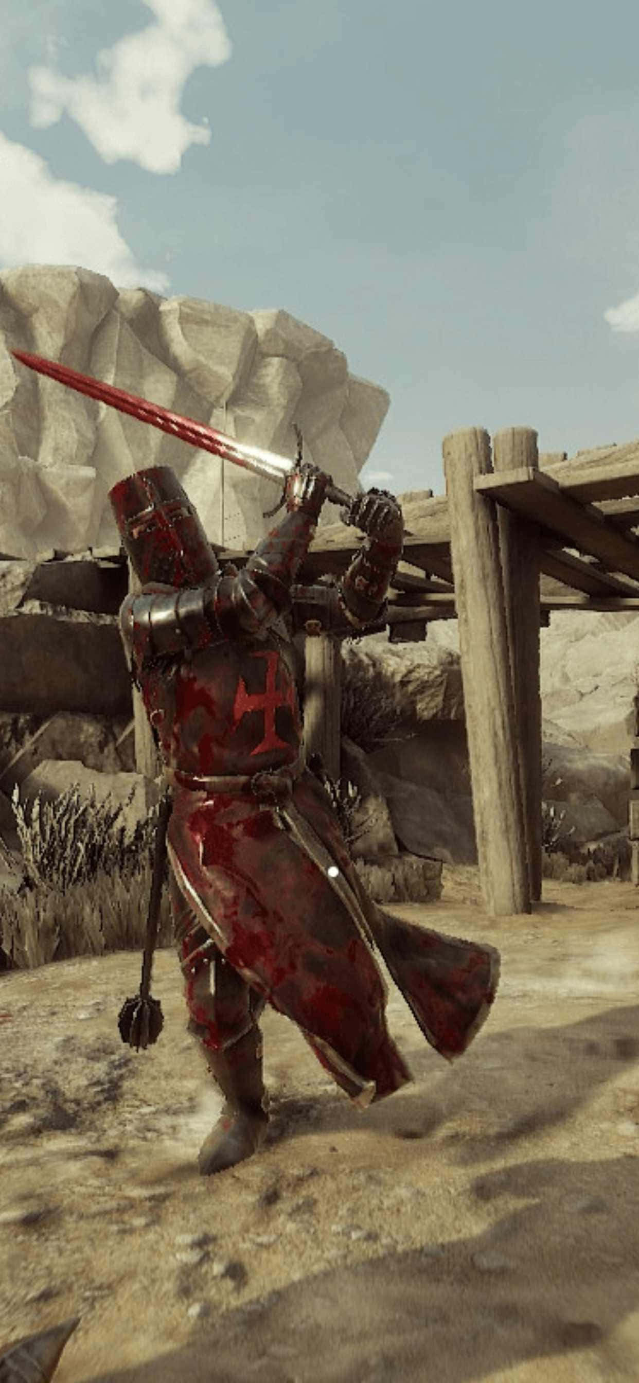 iPhone Xs Max Mordhau 桌布 壁紙 — 一位身穿血跡斑斑盔甲的騎士在晴朗天空下的岩石沙漠前哨站舉起一把發光的紅色劍。