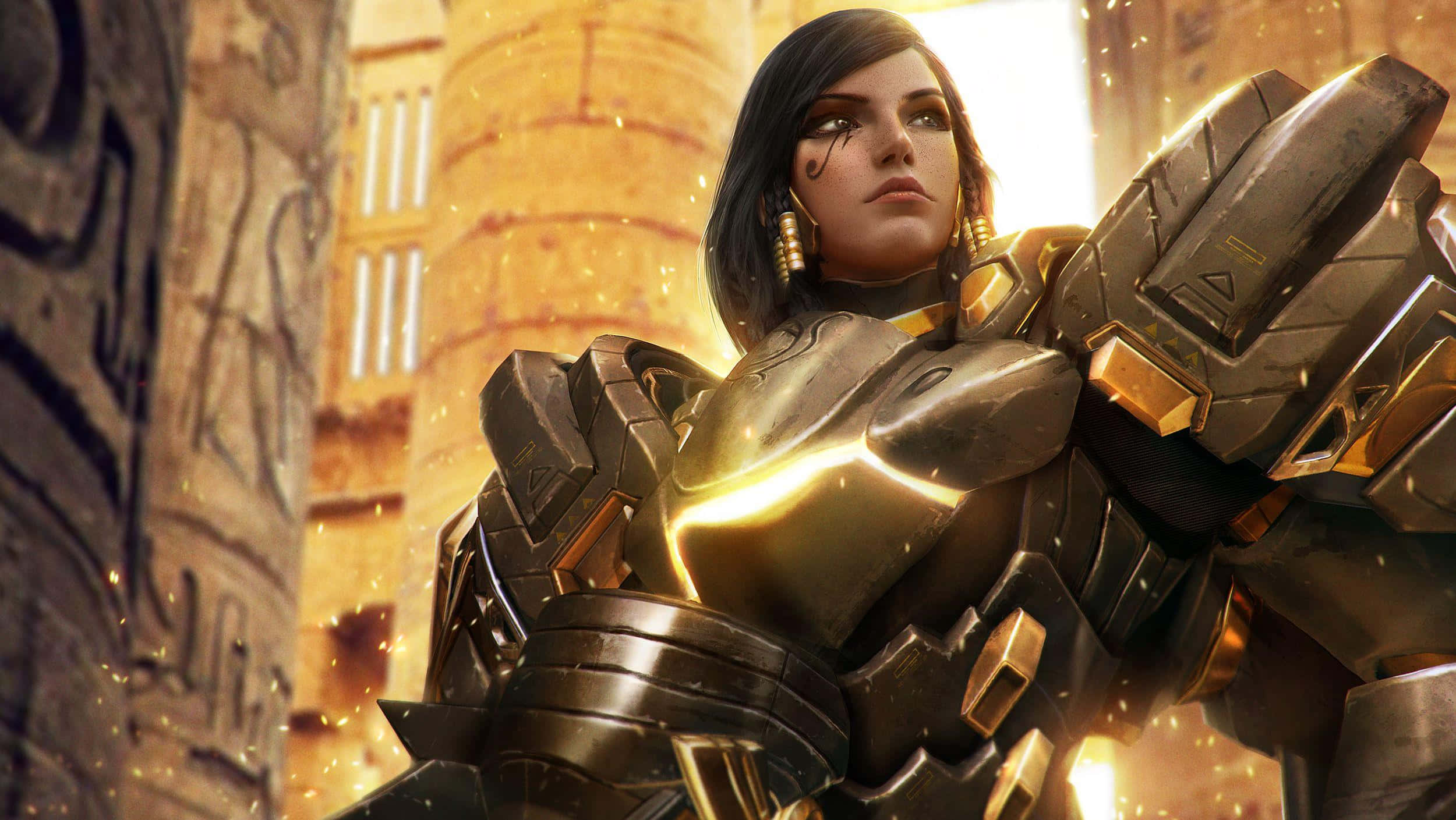 Overwatch Pharah 桌布 壁紙 — 一位身穿金色和黑色裝甲服的女戰士自信地站在沐浴在溫暖陽光下的古埃及遺跡中。