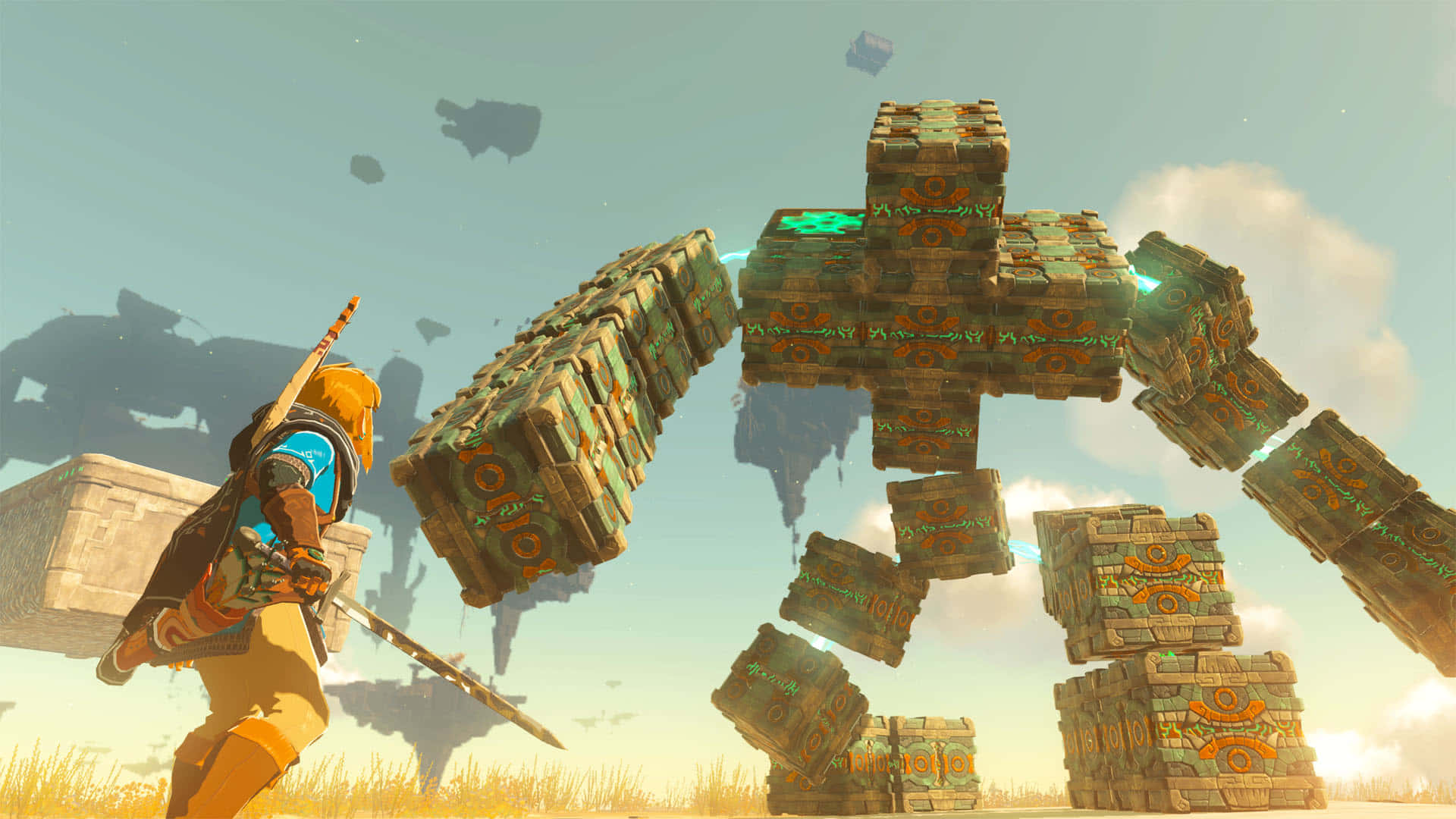 The Legend Of Zelda Tears Of The Kingdom 桌布 壁紙 — 一位身穿金色盔甲的戰士在明亮的天空下與由古老方塊組成的巨型石魔像戰鬥。