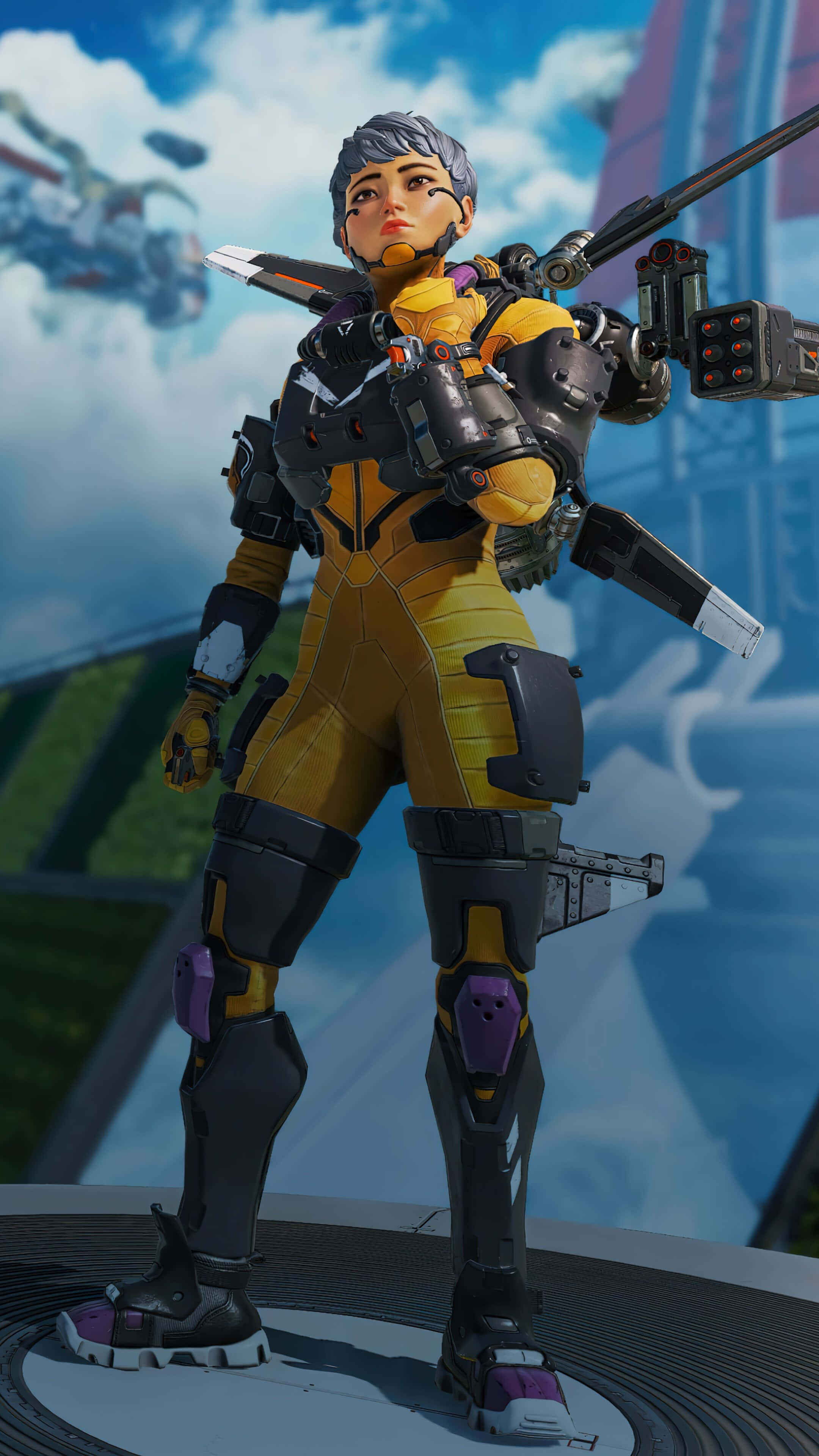 Apex 桌布 壁紙 — 一位身穿黃黑裝甲的未來女戰士，手持大型武器，以多雲的天空為背景，蓄勢待發。