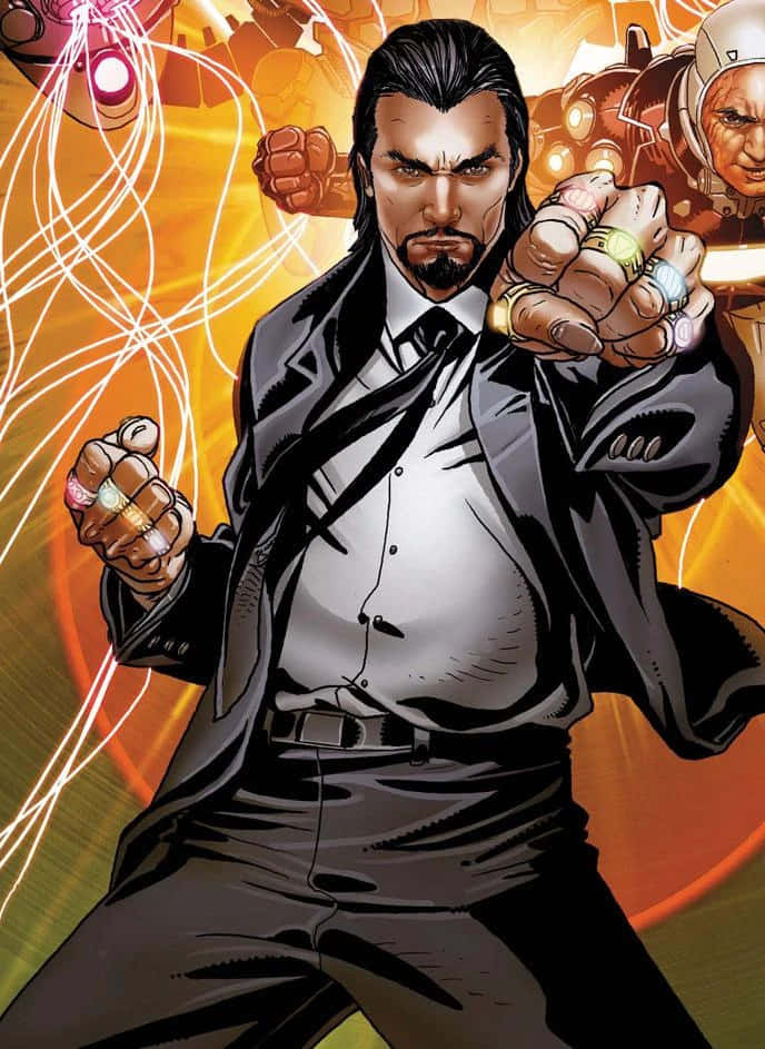 Iron Man Villains 桌布 壁紙 — 一位身穿黑色西裝的兇猛漫畫英雄，在熾熱的橙色和黃色能量背景下揮舞著發光的戒指。