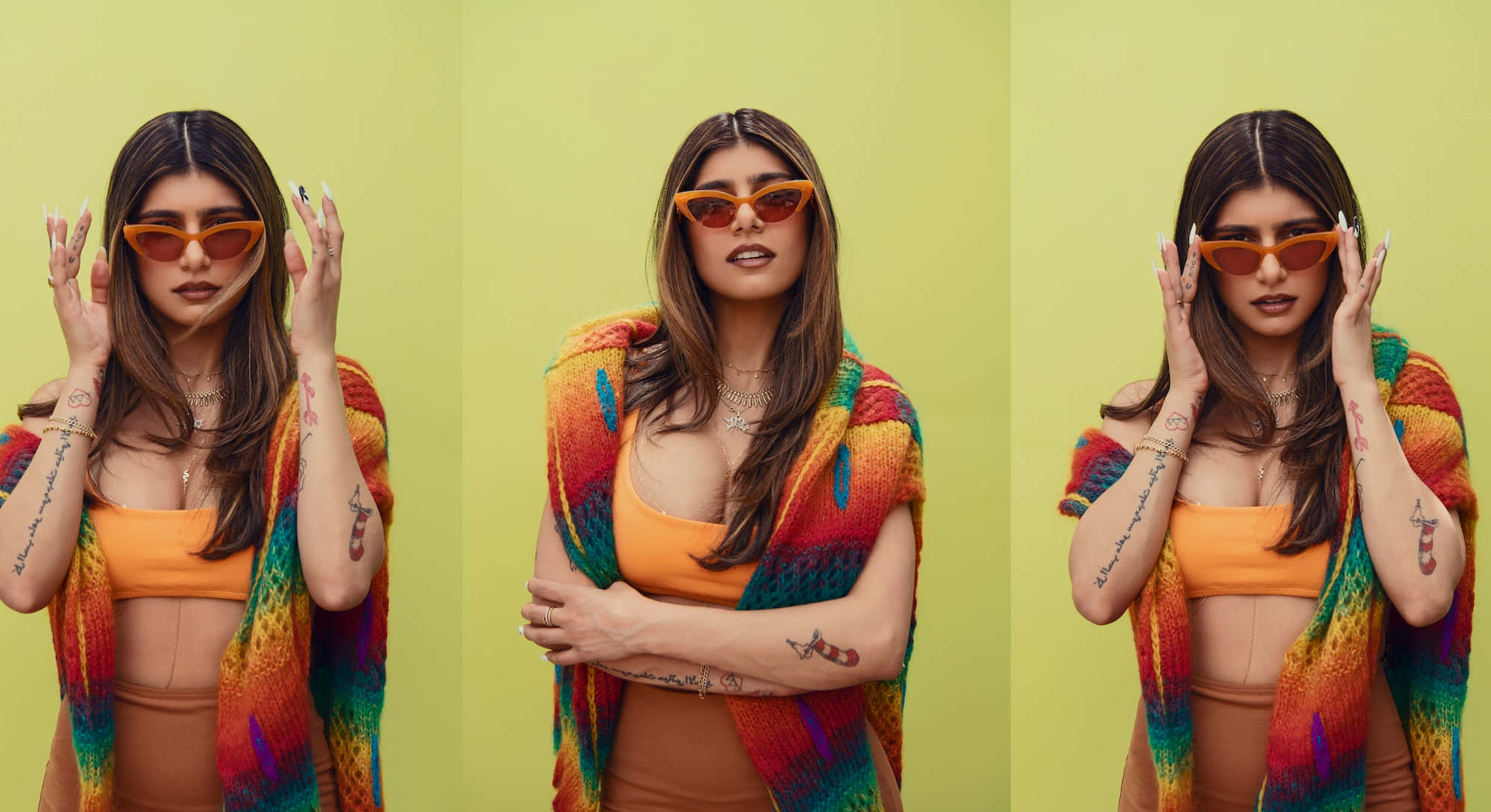 Mia Khalifa 桌布 壁紙 — 一位長棕色頭髮的女性戴著橙色太陽眼鏡和色彩繽紛的彩虹針織披肩，背景是純青檸綠色。