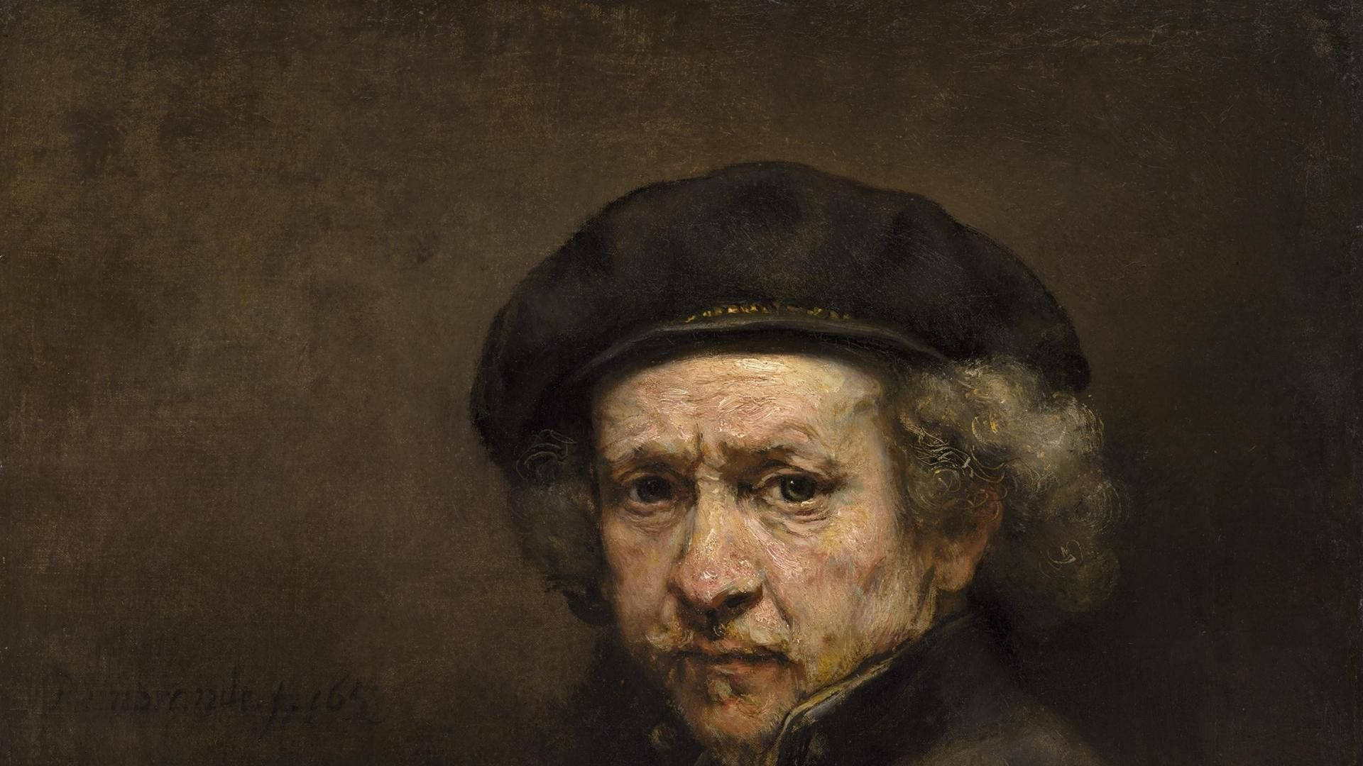 Rembrandt 桌布 壁紙 — 一位長者的特寫肖像，他有灰色捲髮並戴著黑色帽子，以豐富、有質感的油畫技法繪製，搭配強烈的明暗對比燈光。