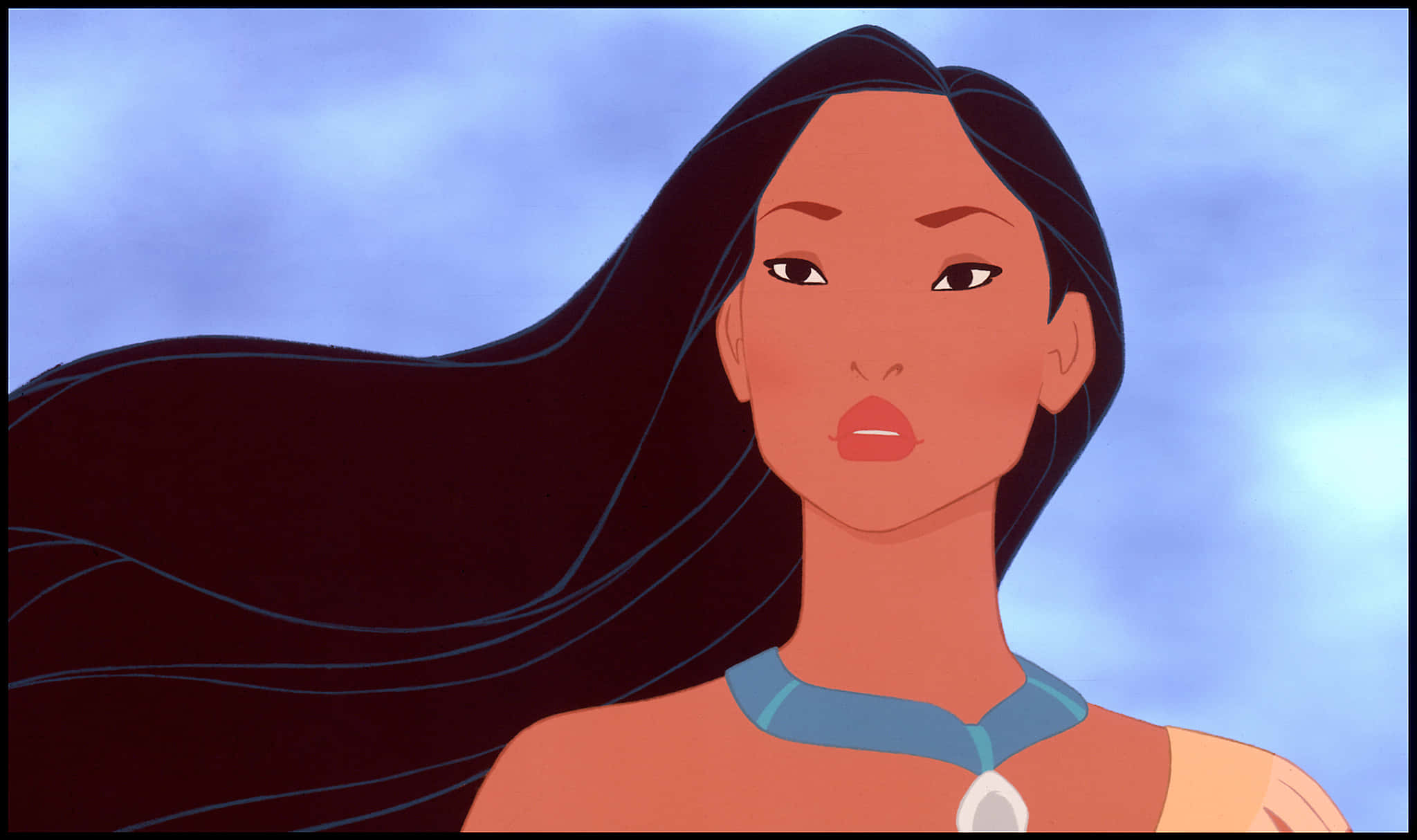 Disney Profile 桌布 壁紙 — 一位長黑髮、戴藍色項鍊的女性特寫，背景是柔和的藍天。