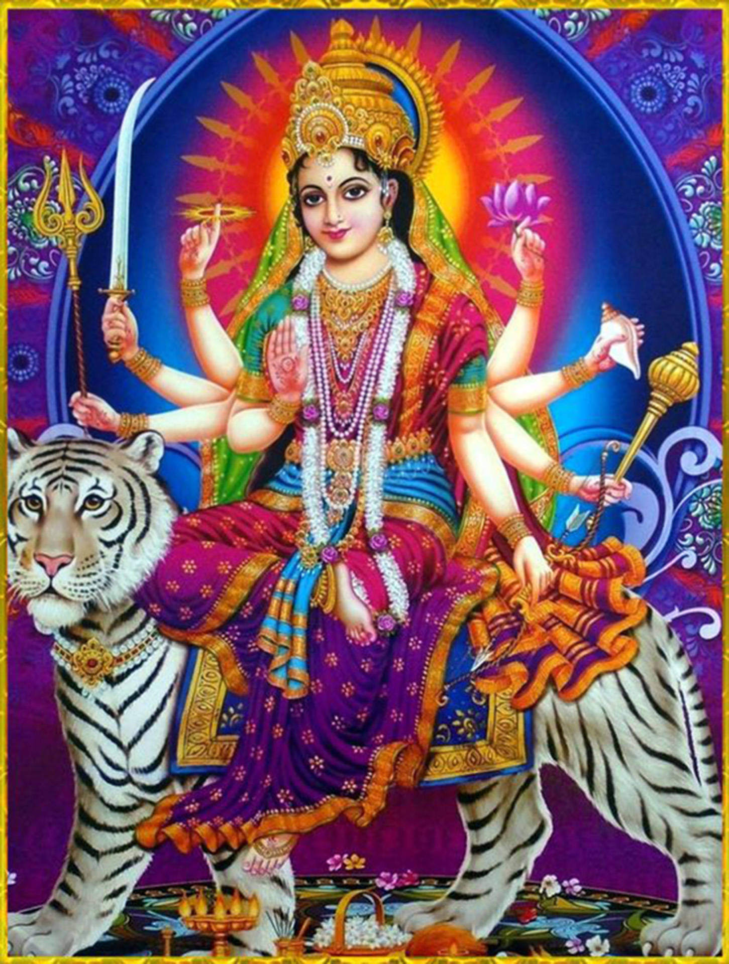 Indian 桌布 壁紙 — 一位閃耀的多臂印度教女神，佩戴珠寶和鮮豔長袍，威嚴地坐在老虎上，背景是宇宙曼陀羅。