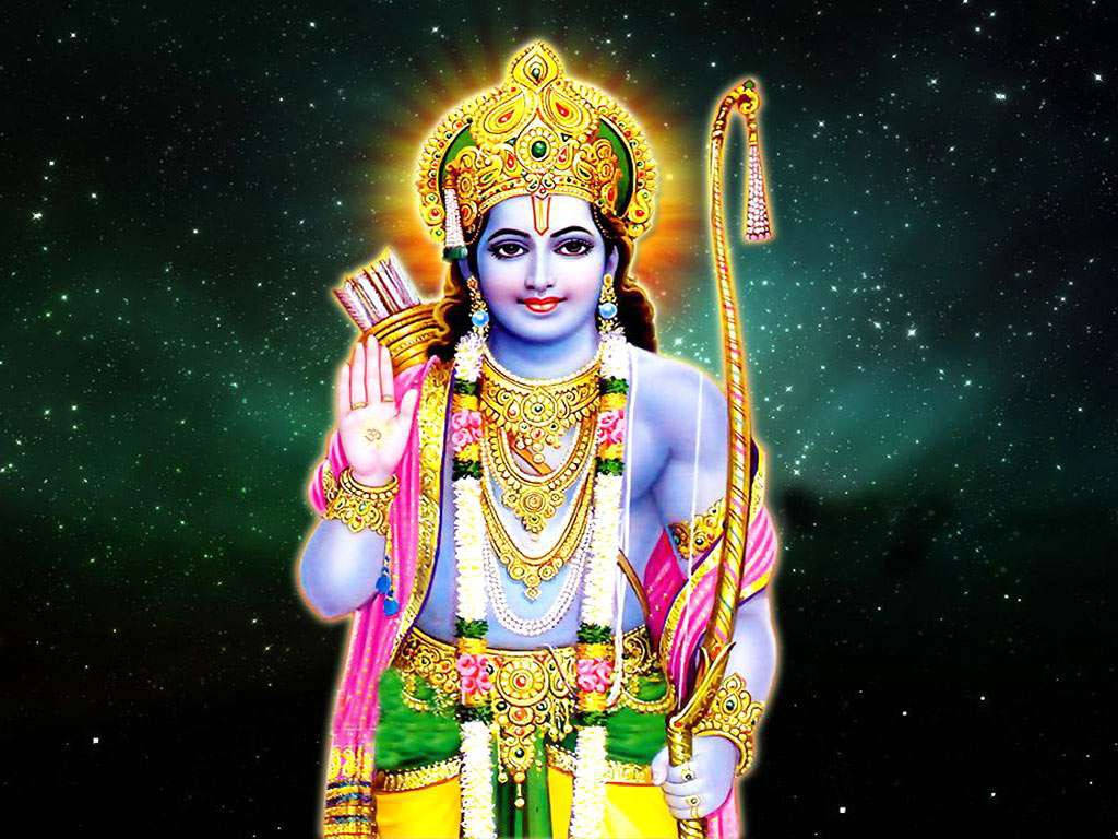 jai shri ram 桌布 壁紙 — 一位閃耀的藍皮膚印度教神祇，飾有金色珠寶和粉紅色服飾，手持弓箭，背景是繁星點點的宇宙。