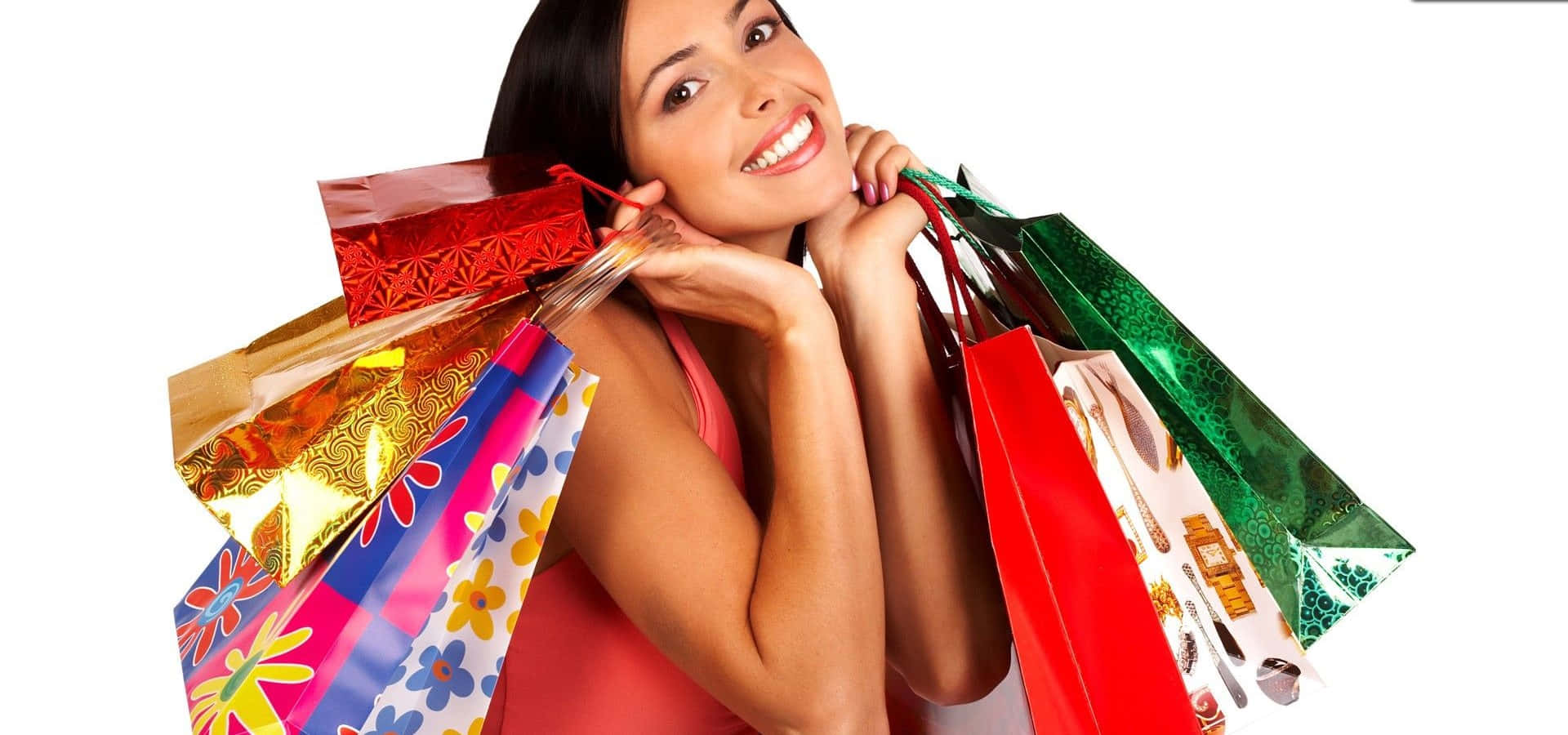Shopping 桌布 壁紙 — 一位開心的女士在白色背景前微笑，手持色彩繽紛的購物袋。