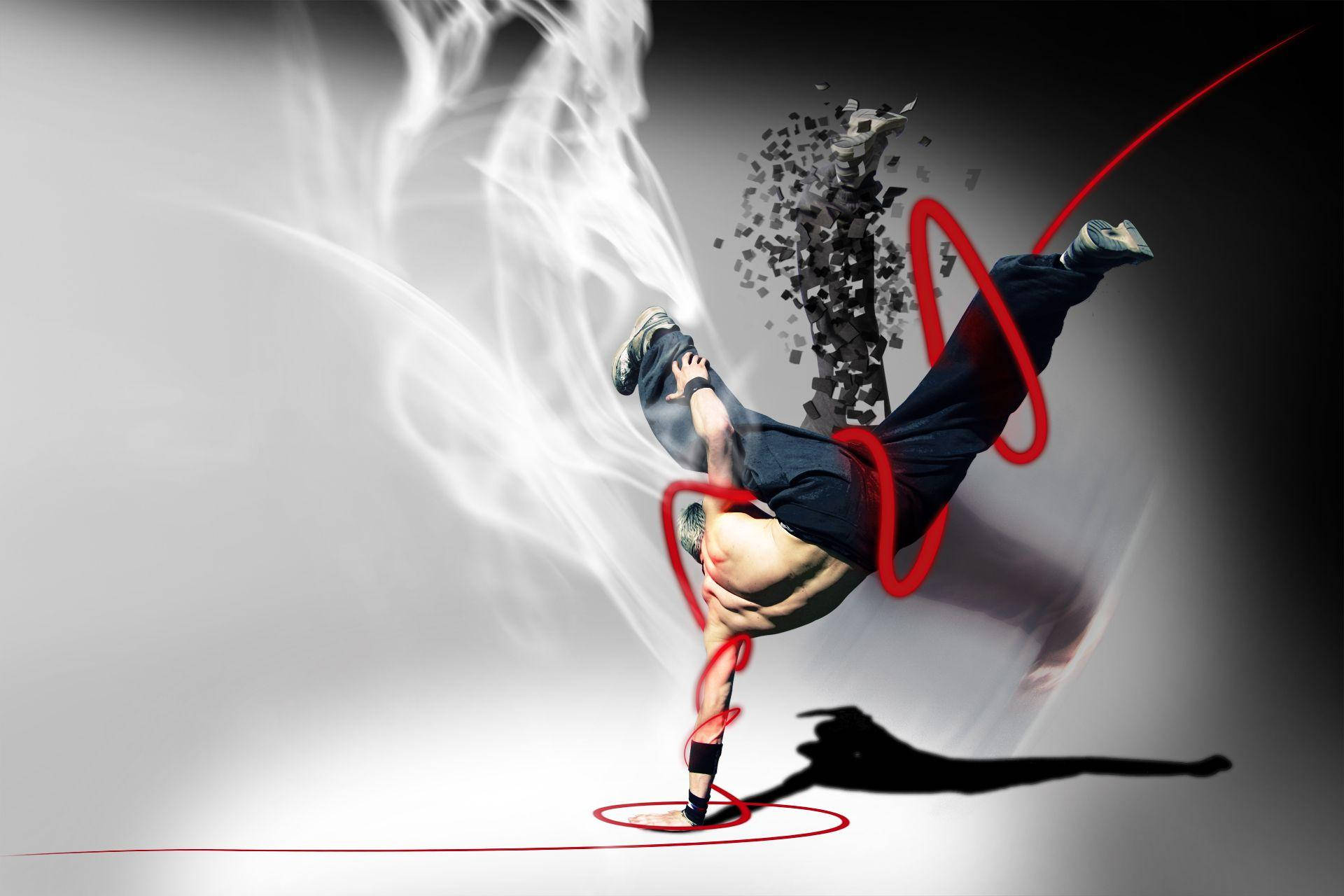 舞蹈 桌布 壁紙 — 一位霹靂舞者在漸變灰色背景上，以紅色動態線條和白色煙霧表演動態的倒立旋轉。