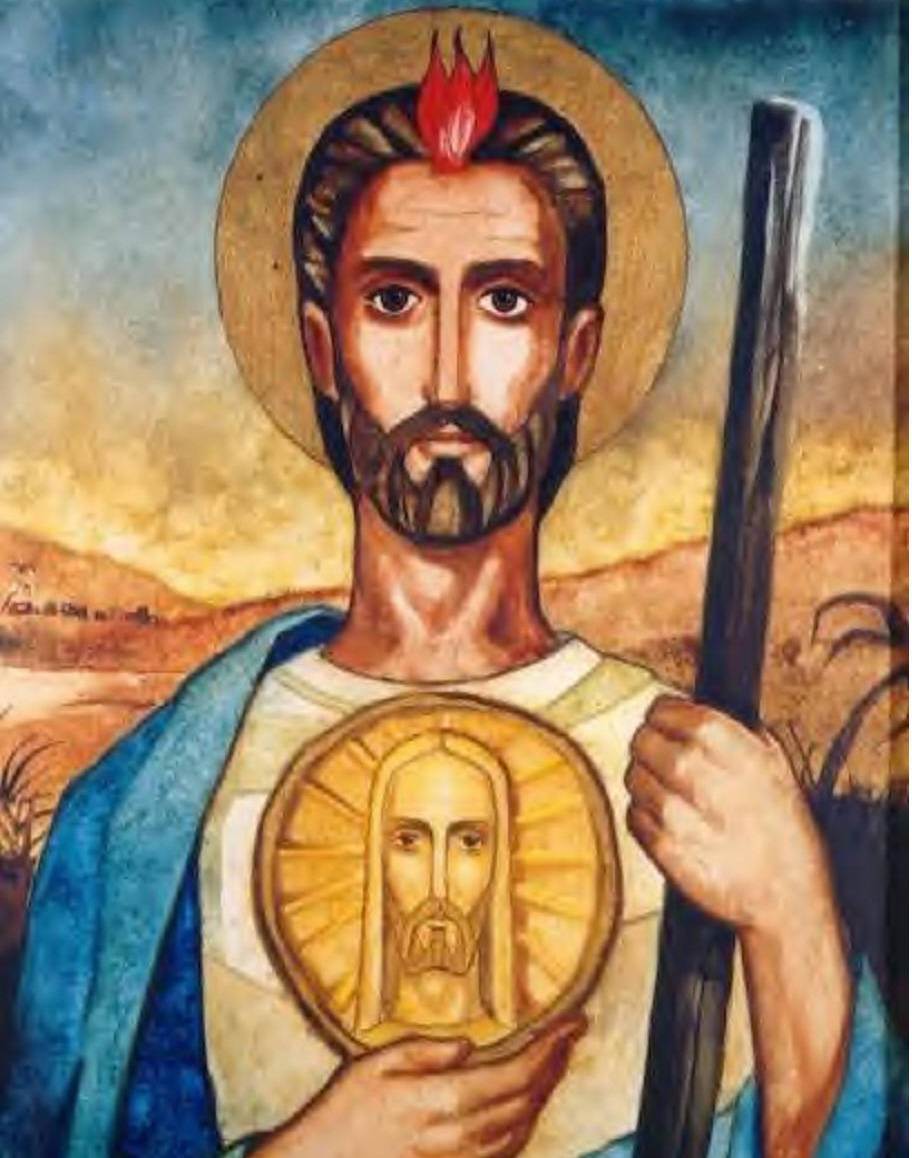 religion 桌布 壁紙 — 一位頭頂光環和紅色火焰的聖人，手持杖和耶穌的金色獎章，背景是溫暖的沙漠。