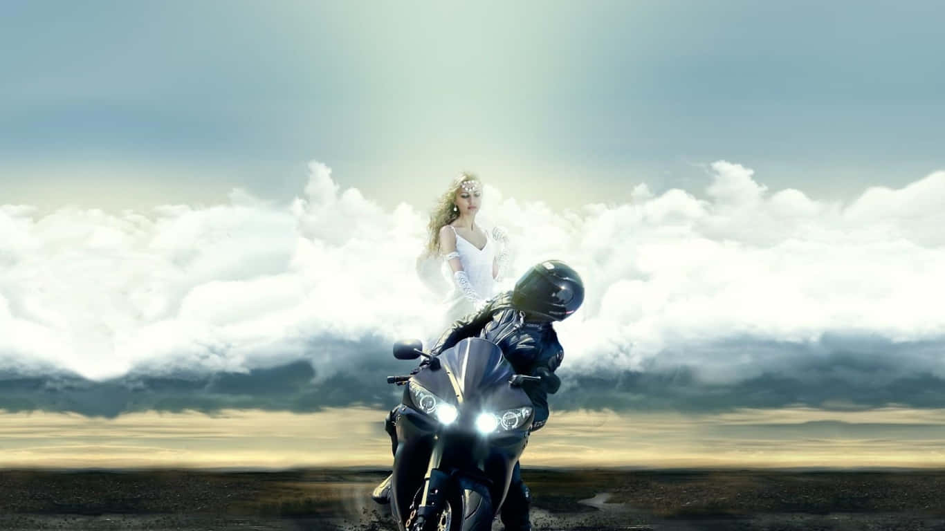 Guardian Angels 桌布 壁紙 — 一位騎士騎著黑色摩托車，車頭燈明亮，面向前方，而一位發光的天使般的女性在戲劇性的雲層中漂浮在上方。