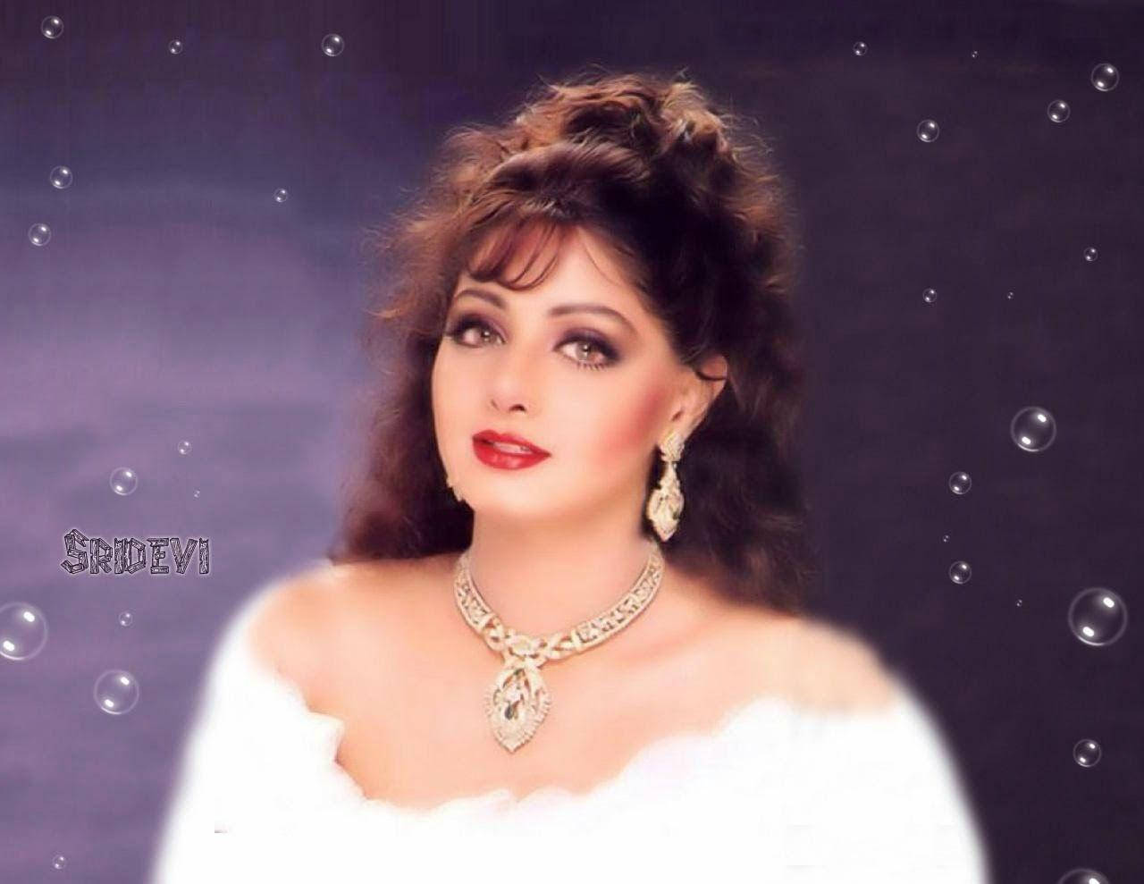 Sridevi 桌布 壁紙 — 一位魅力四射的女性，擁有豐盈的頭髮和大膽的妝容，身穿白色露肩禮服和華麗珠寶，背景為紫色，並有漂浮的泡泡。