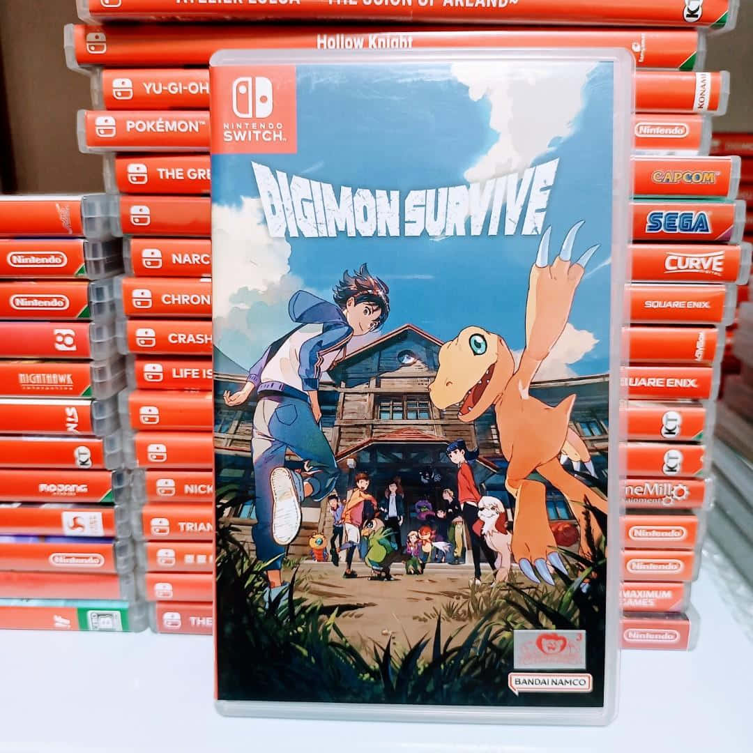 game 桌布 壁紙 — 一個《Digimon Survive》Nintendo Switch 遊戲盒放在正中央，周圍堆滿其他紅色遊戲卡帶。