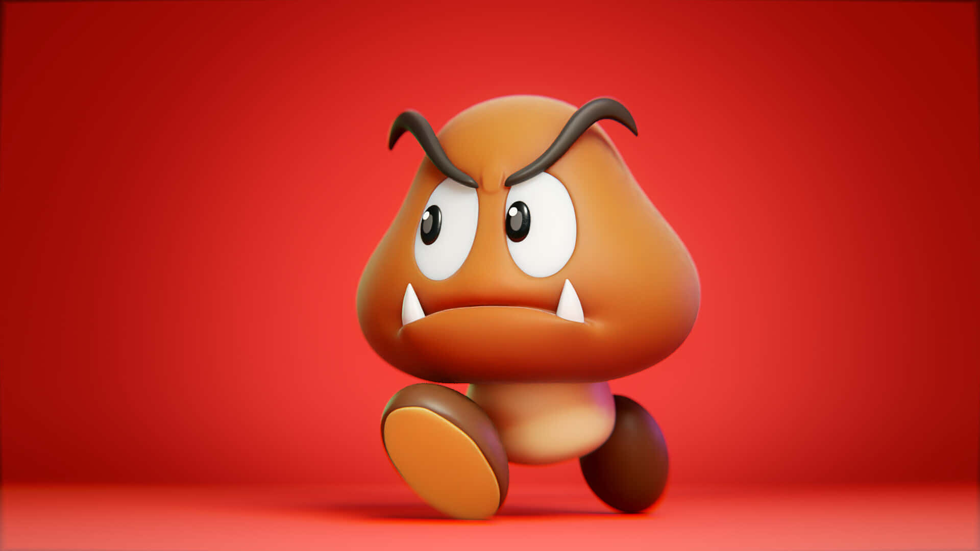 Goomba 桌布 壁紙 — 一個3D渲染的Goomba角色，帶著憤怒的眼睛和尖牙，在純紅色背景上向前奔跑。
