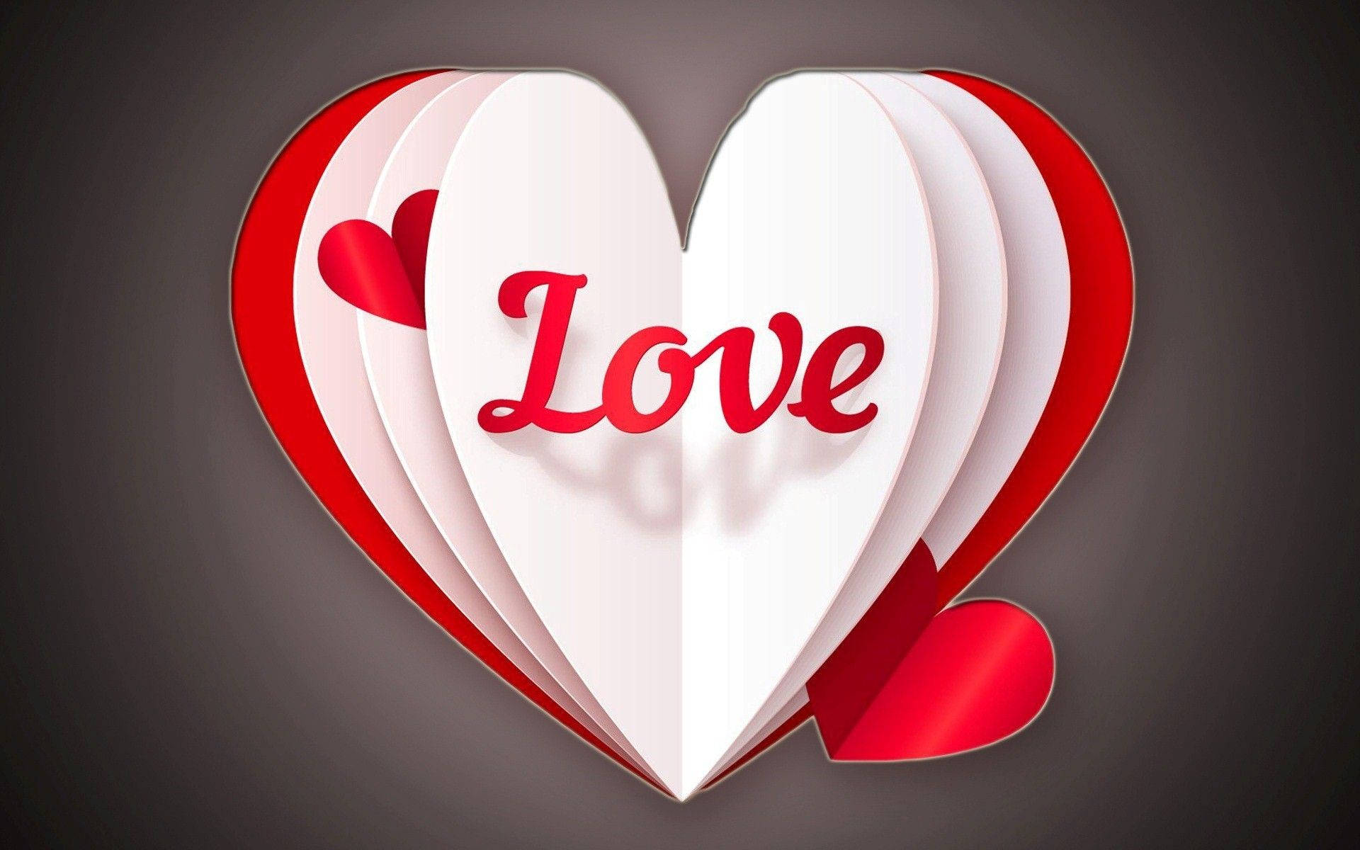Love Heart 桌布 壁紙 — 一個3D紙愛心，帶有紅色「Love」文字和小愛心，層疊在深灰色背景上。