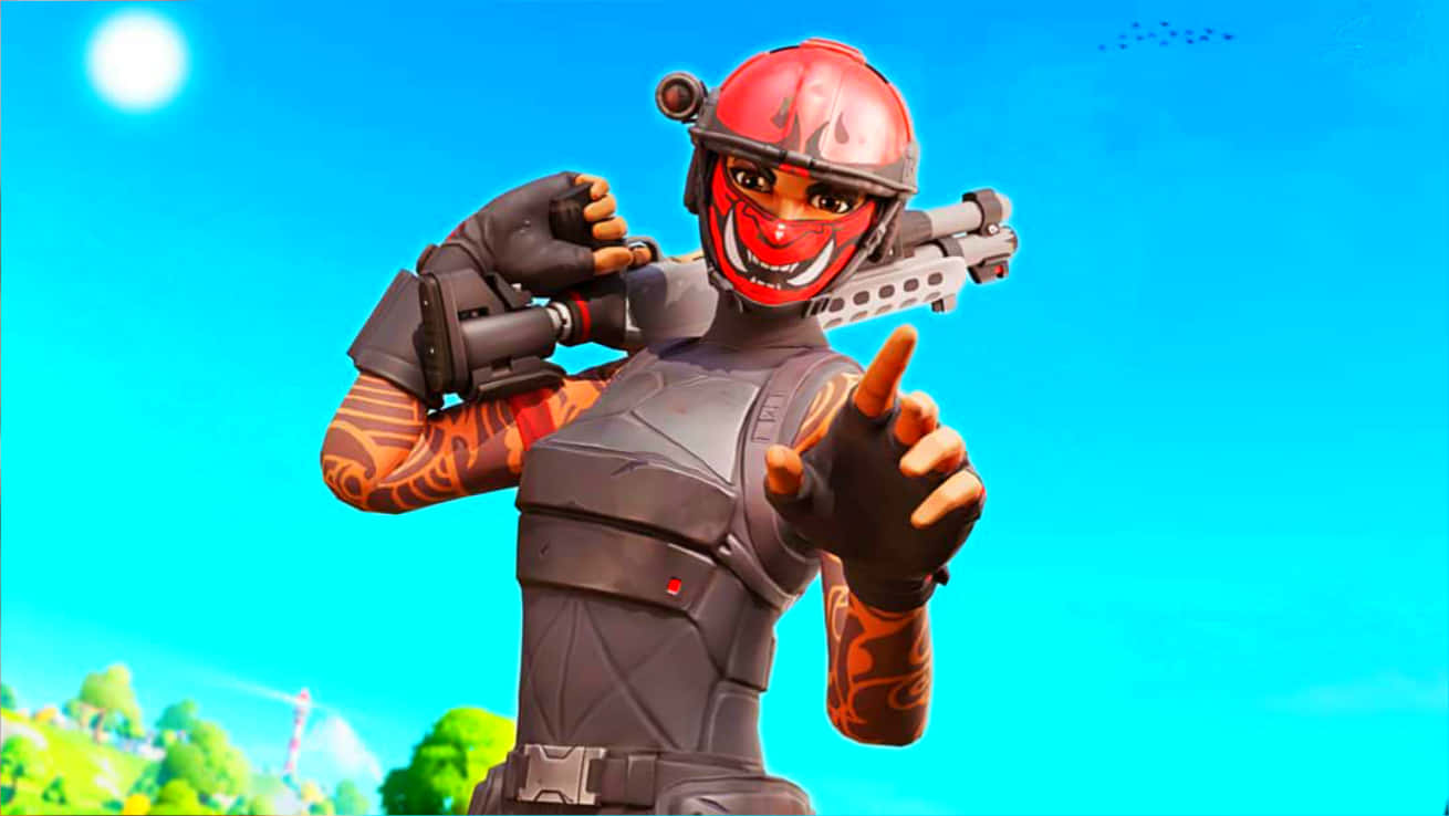 Fortnite 造型 桌布 壁紙 — 一個Fortnite角色戴著紅色火焰面具和盔甲，在明亮的陽光下手持武器指向前方。