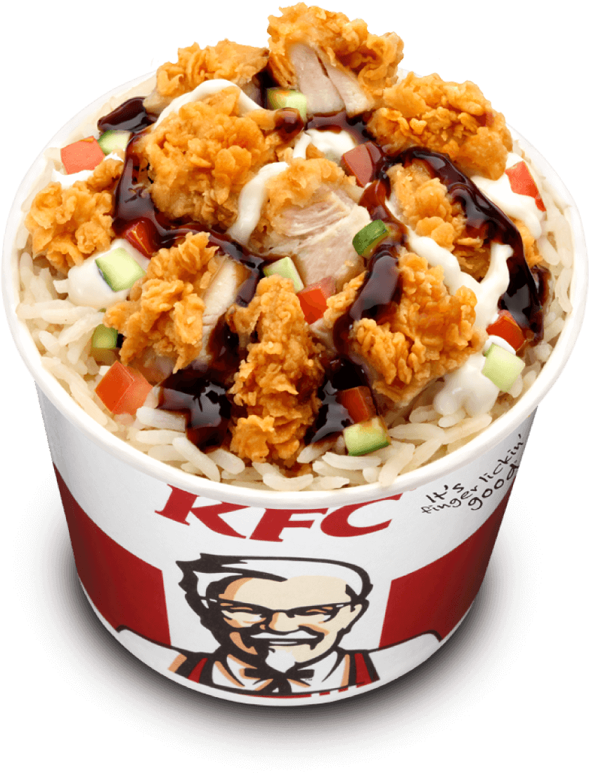 肯德基 桌布 壁紙 — 一個KFC桶，裝滿酥脆炸雞塊，淋上深色醬汁，放在白飯和色彩繽紛的蔬菜上。