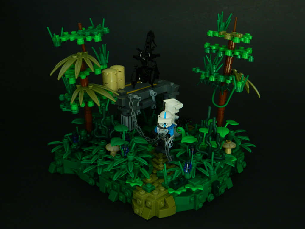 高清 桌布 壁紙 — 一個LEGO叢林立體模型，有綠色葉子的棕櫚樹和一個被鎖鏈鎖住的風暴兵人偶，背景為黑色。