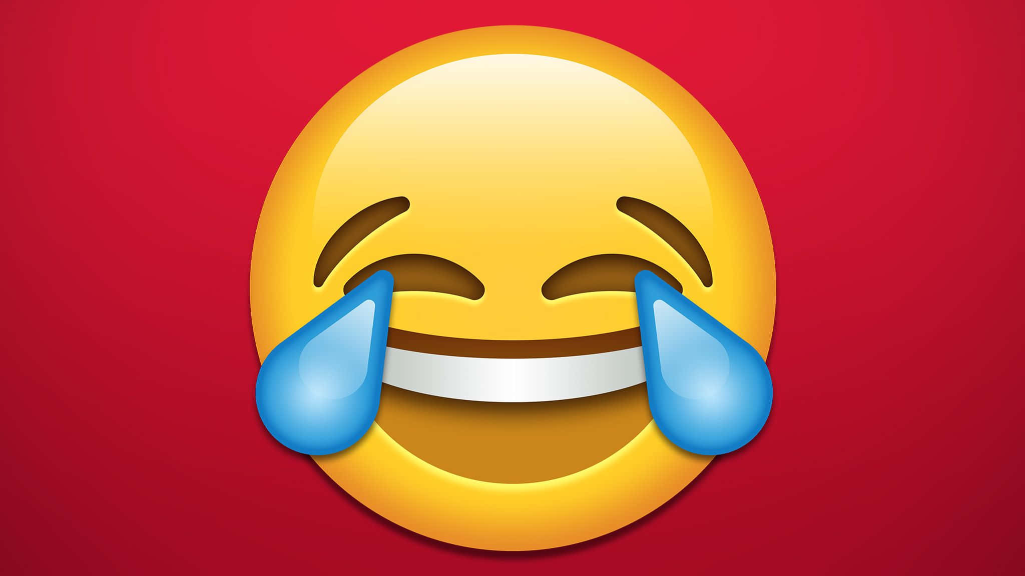 Laughing 桌布 壁紙 — 一個亮黃色大笑的表情符號，帶著藍色眼淚，在純紅色背景上咧嘴大笑。