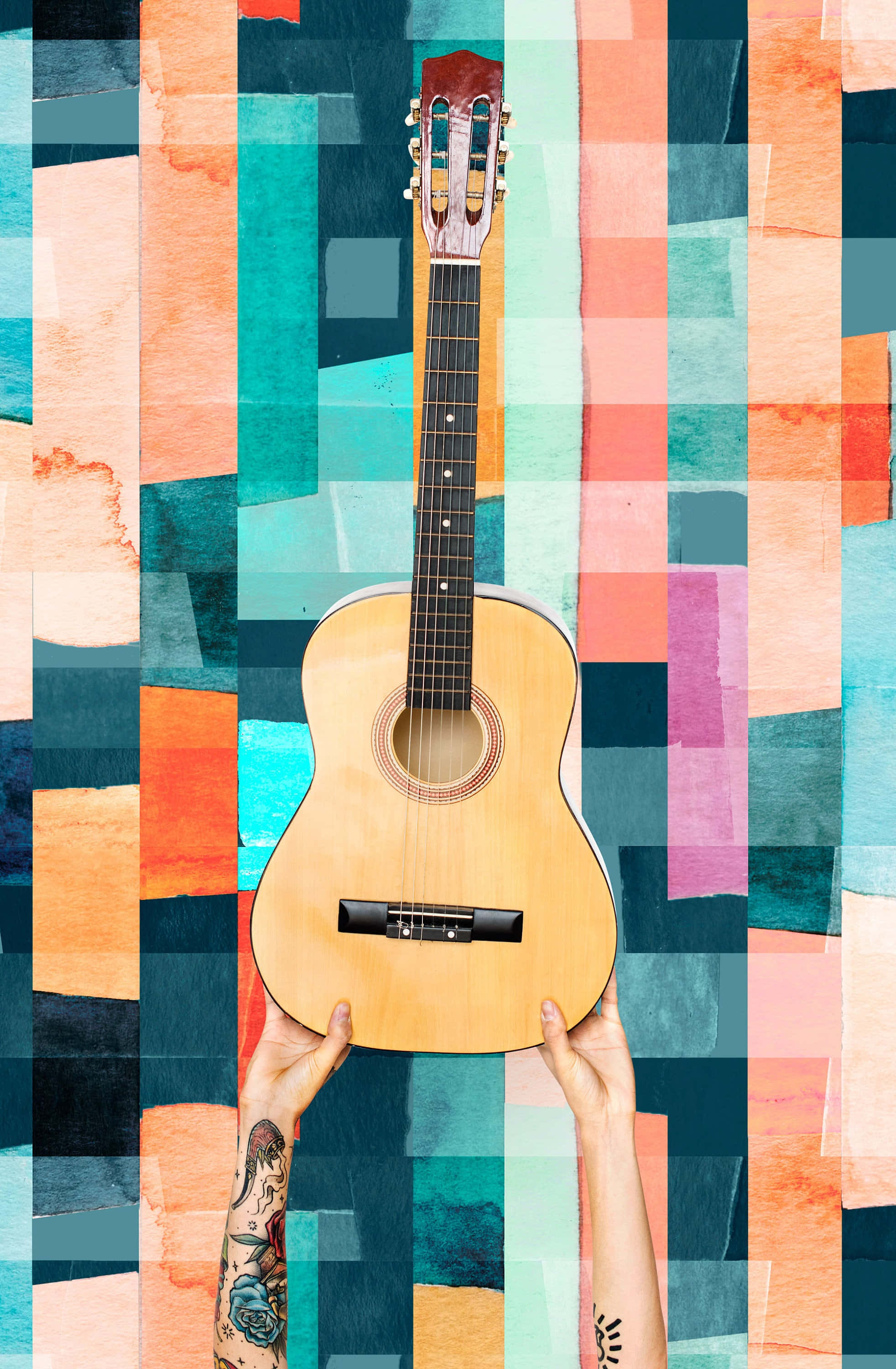 Guitar Aesthetic 桌布 壁紙 — 一個人拿著一把淺色木吉他，背景是充滿活力的抽象水彩塊，顏色包括青綠、橙色和粉紅色。