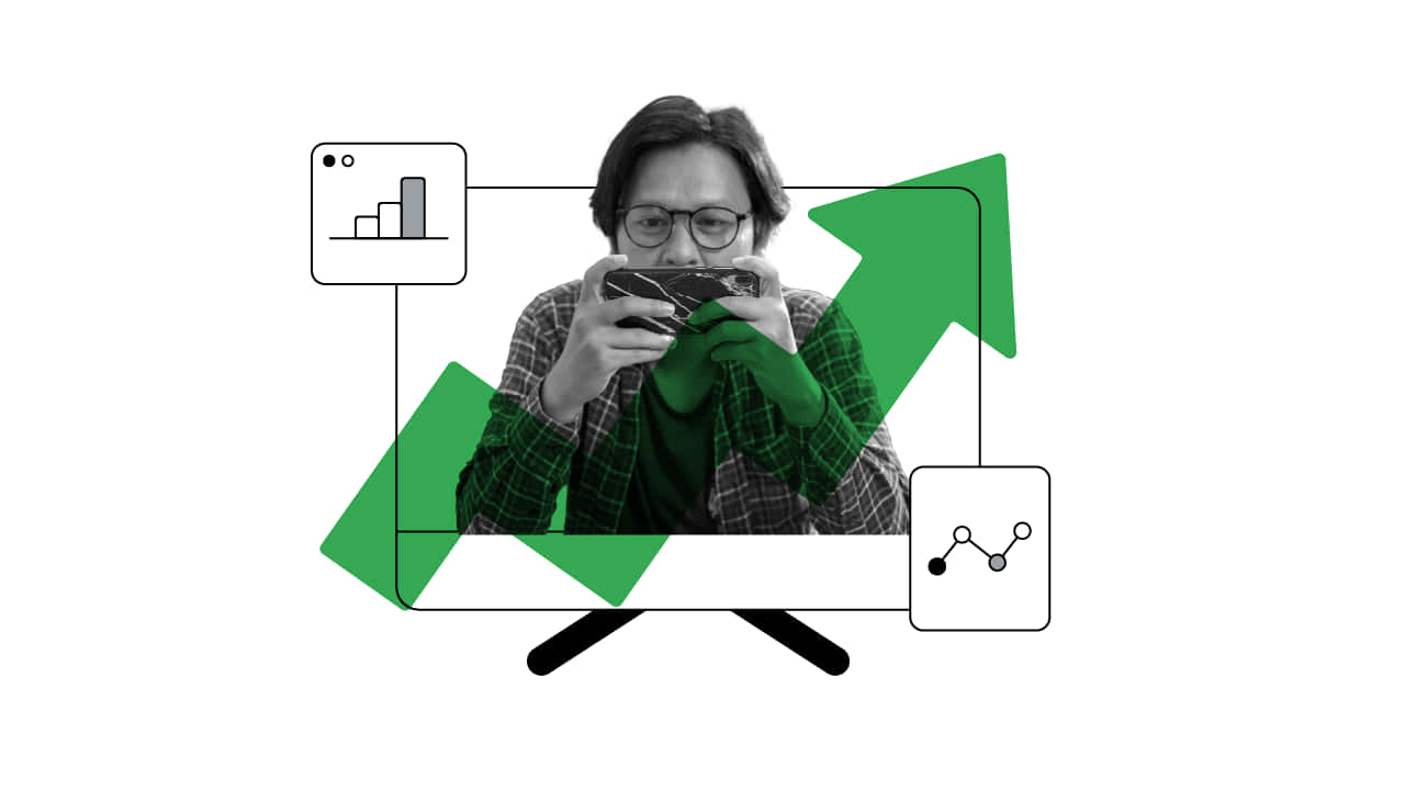 遊戲 桌布 壁紙 — 一個人正在專注地玩掌上型遊戲機，周圍環繞著綠色向上箭頭和數據圖表。